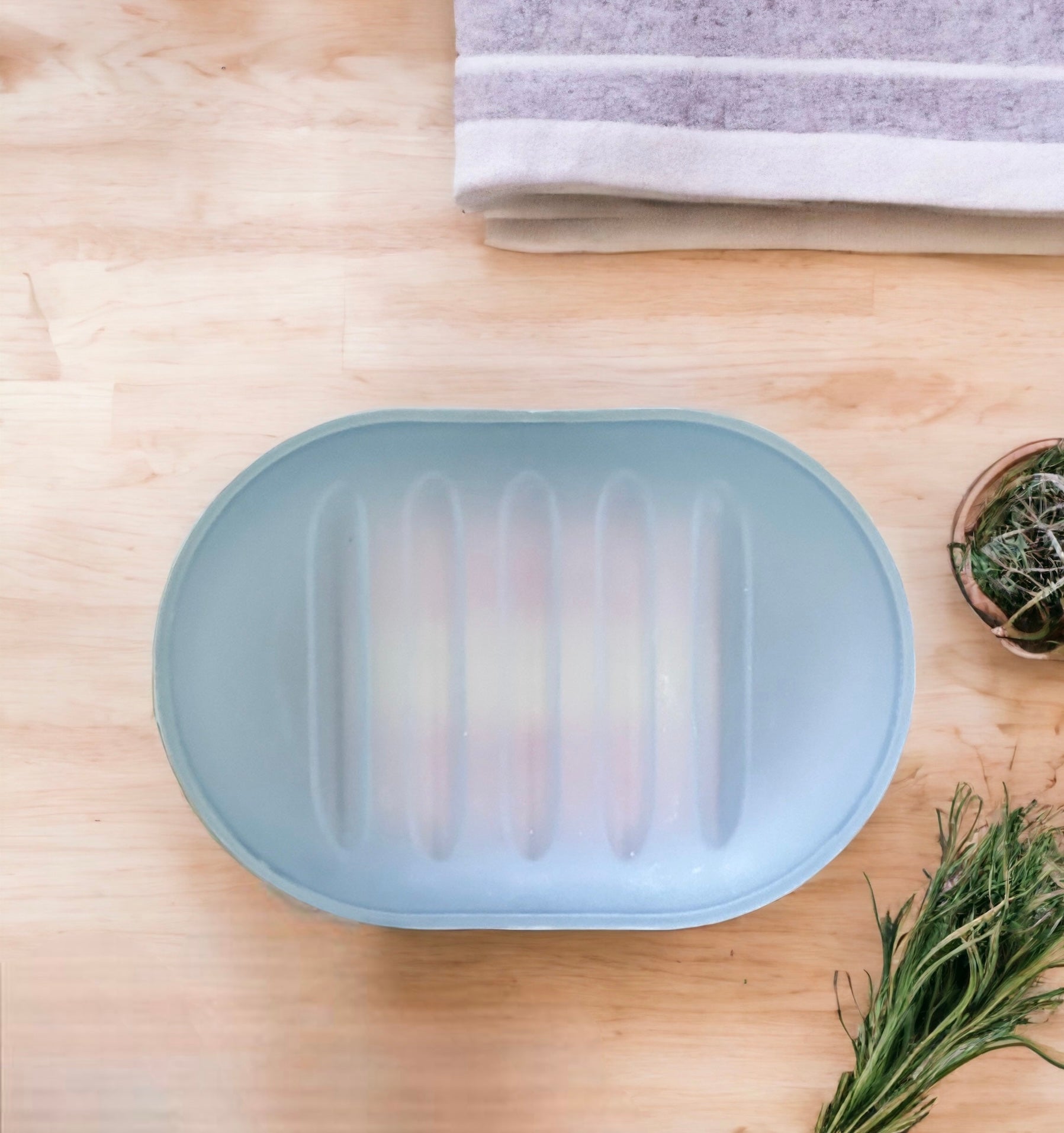 Travel soap dish on a wooden surface