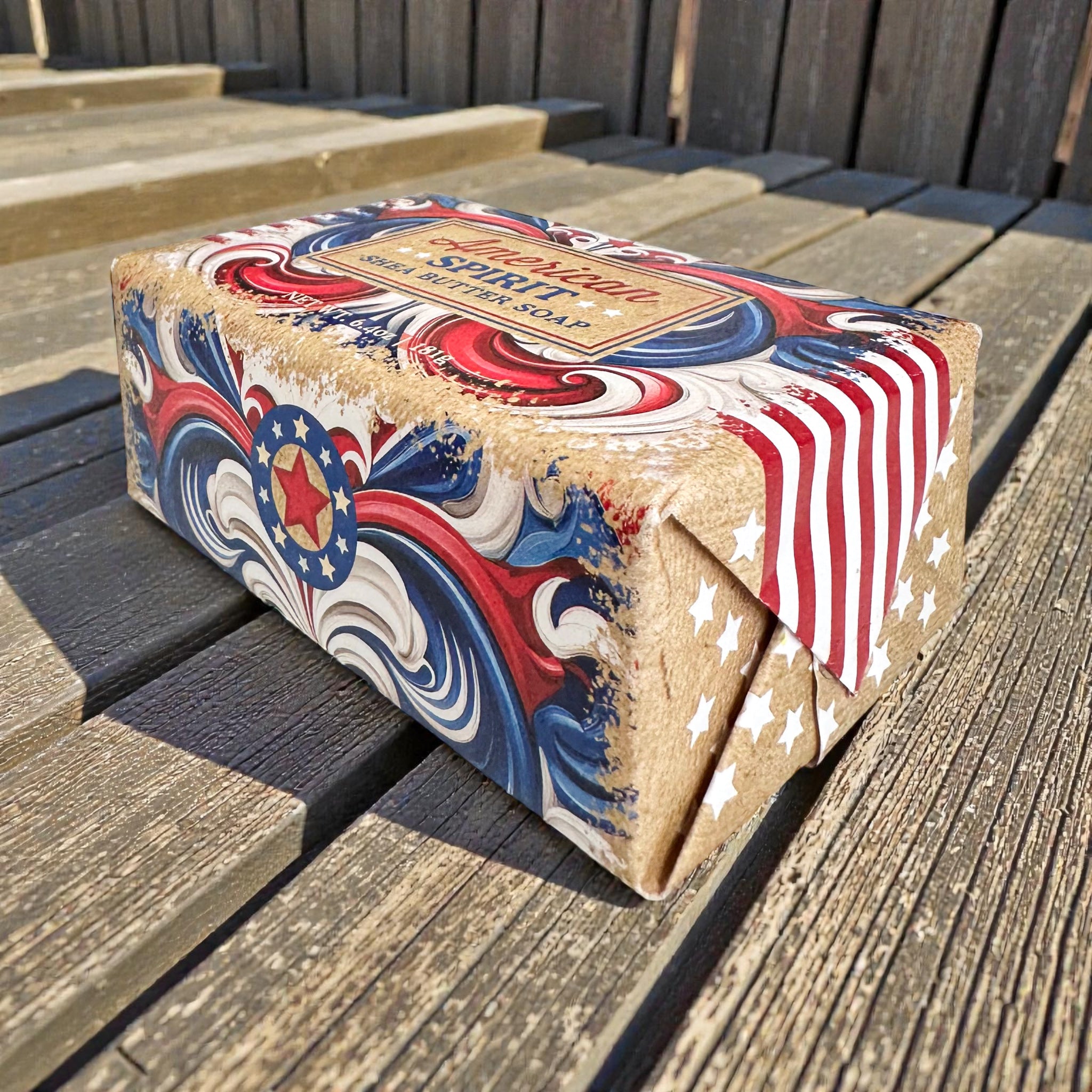 American Spirit shea butter soap bar on wooden deck with patriotic label