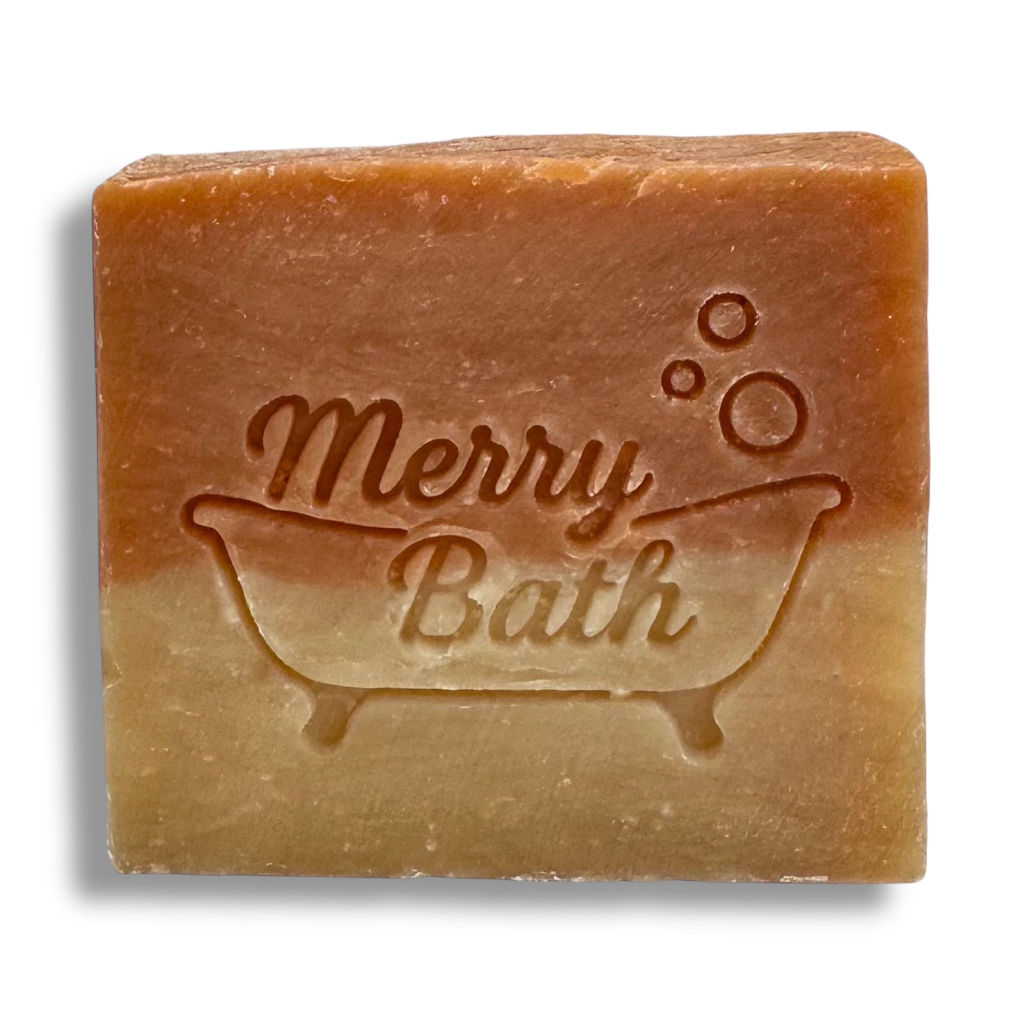 A rectangular bar of handmade bath soap with a warm brown and beige gradient, embossed with the text 'Merry Bath' and a bathtub design, shown on a white background with a soft drop shadow.