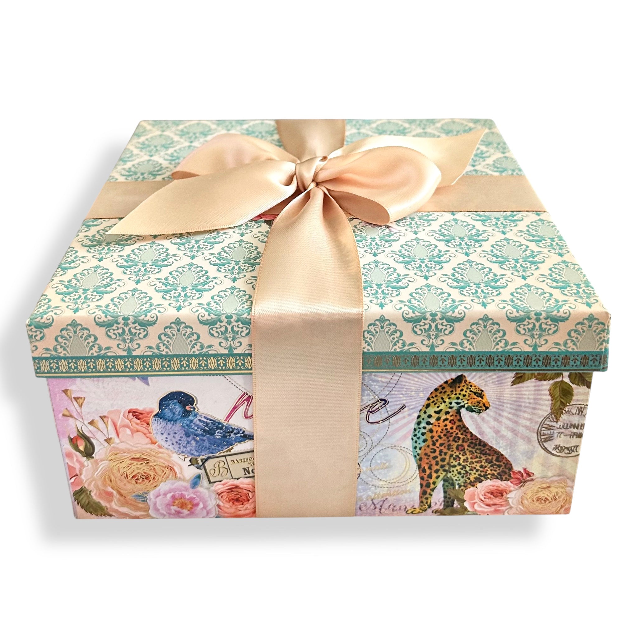 Bath gift set box with teal patterned top and satin bow ribbon