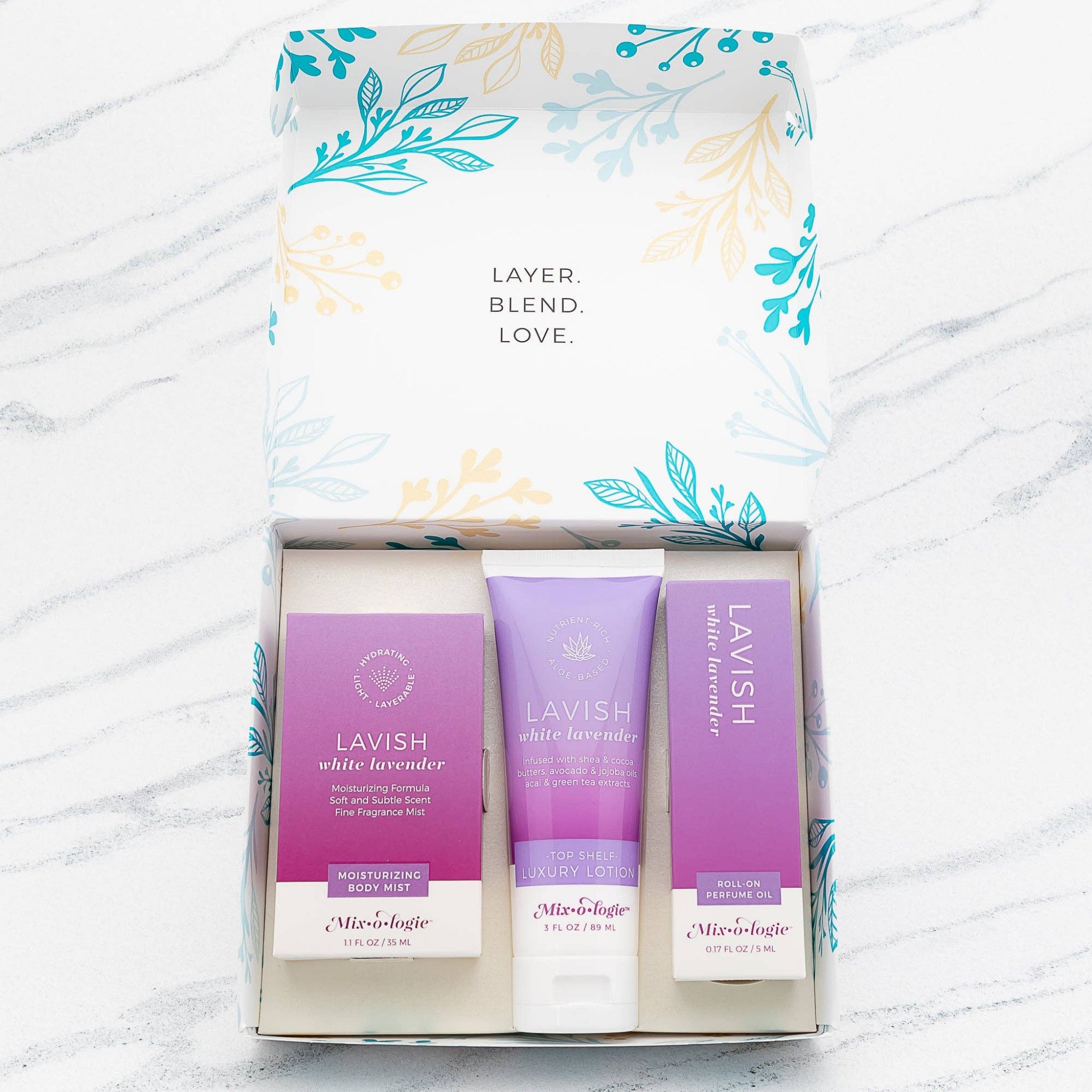 Gift set box showing three white lavender skincare items in purple and white packaging