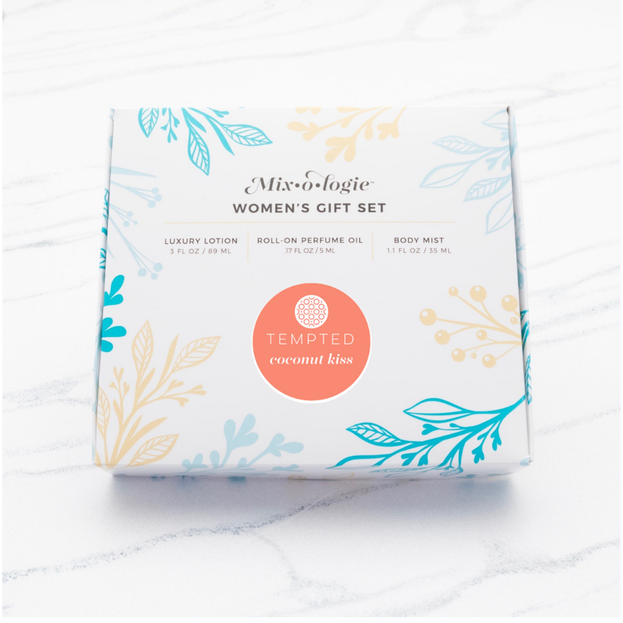 Gift set packaging with floral designs and 'Tempted Coconut Kiss' branding on a white background
