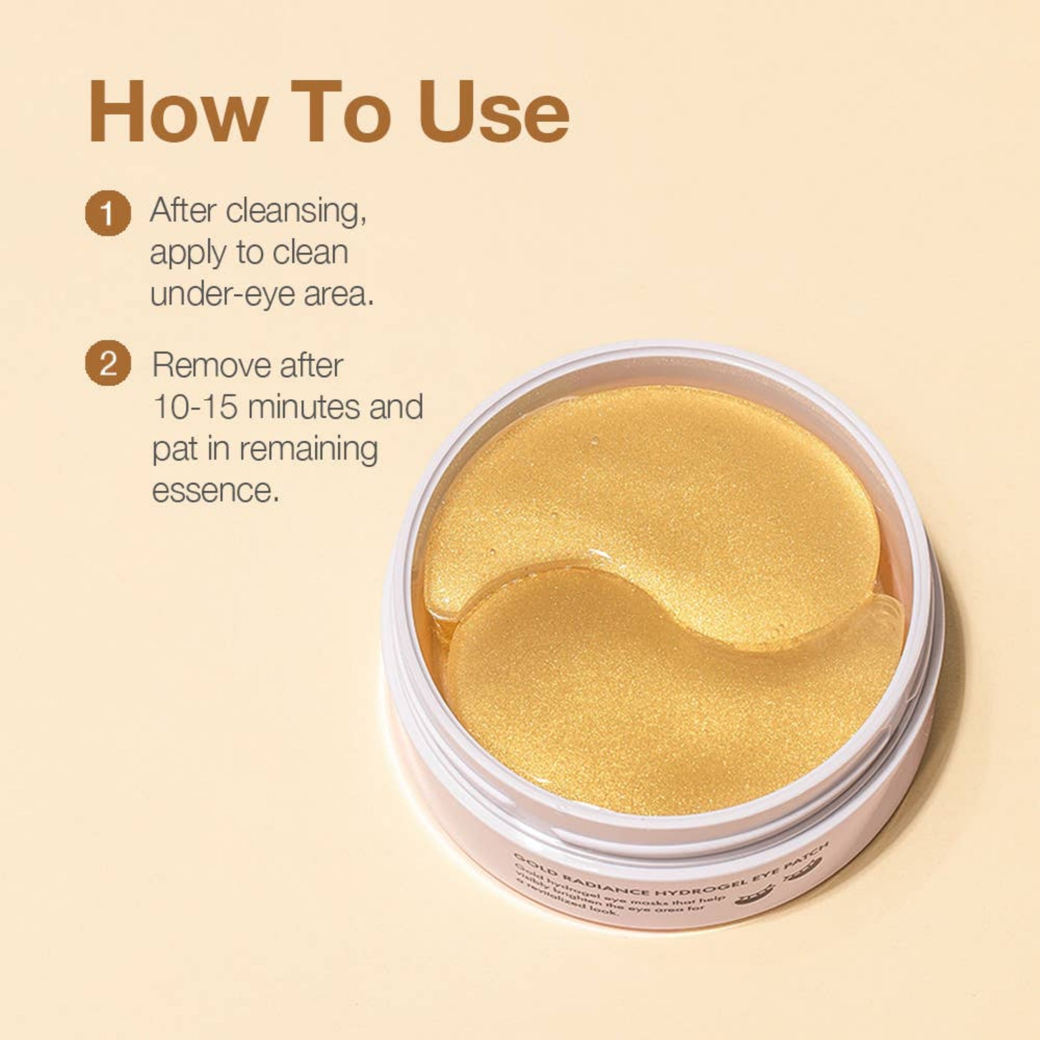 Gold eye patches in a container with usage instructions on a beige background