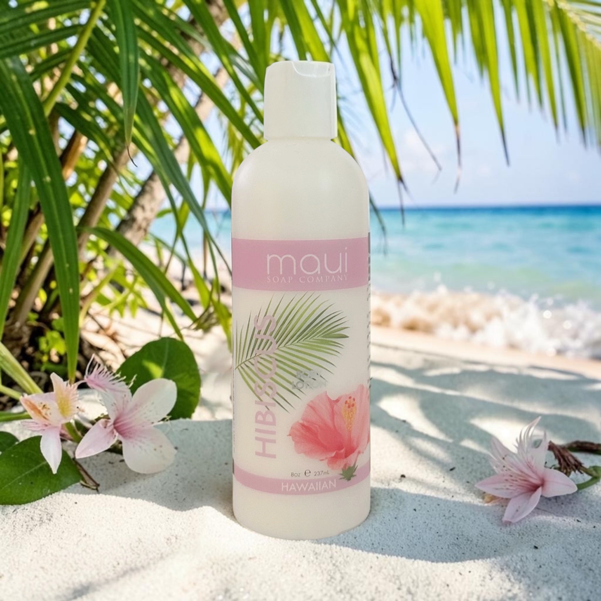 White body lotion bottle with pump dispenser and tropical hibiscus label.