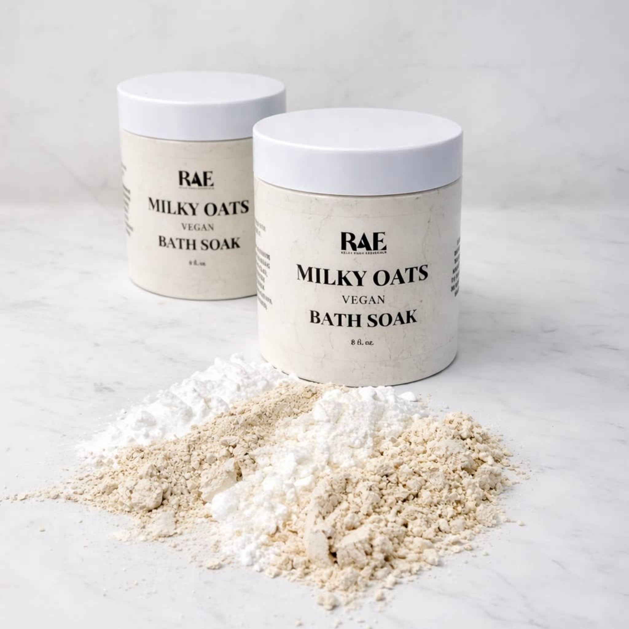Milky oats bath soak jar set with cream powder mounds on a light surface
