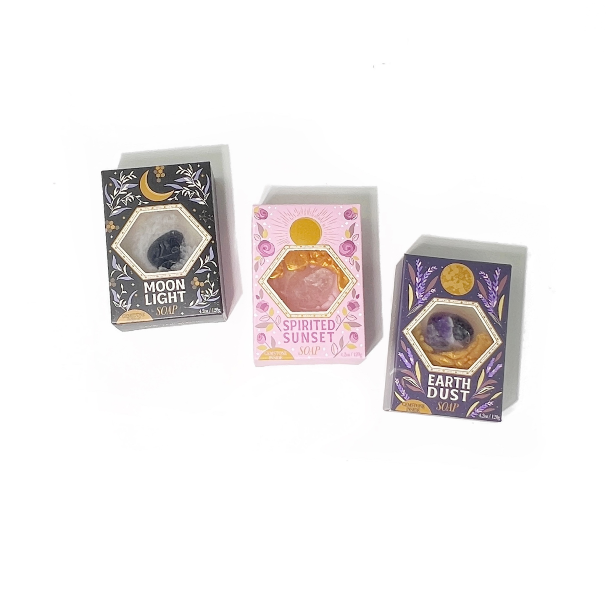 Three soap packages labeled 'Moon Light', 'Spirited Sunset', and 'Earth Dust' on a white background.