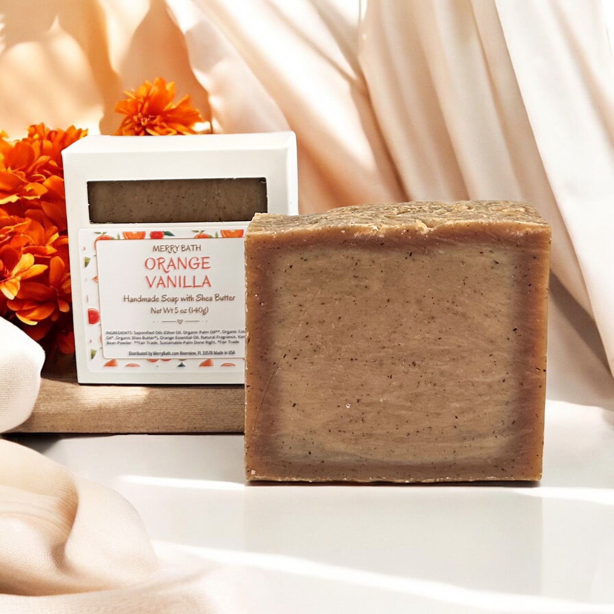 Bar of soap with 'Orange Vanilla' packaging on a light background