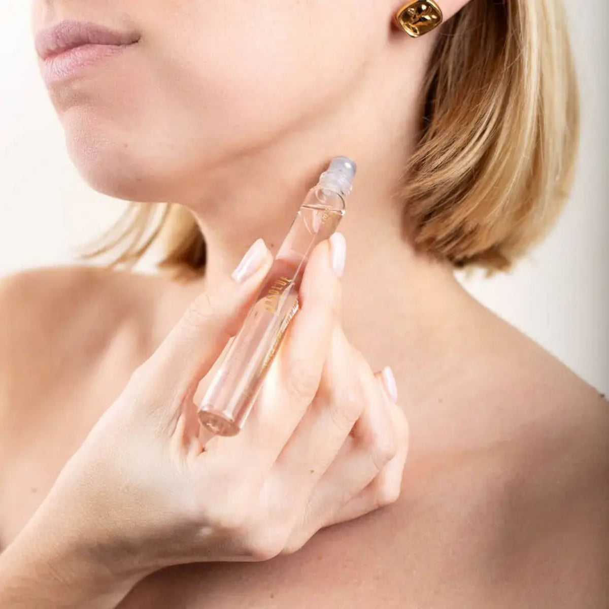 Rose perfume EDT bottle with clear glass and gold cap