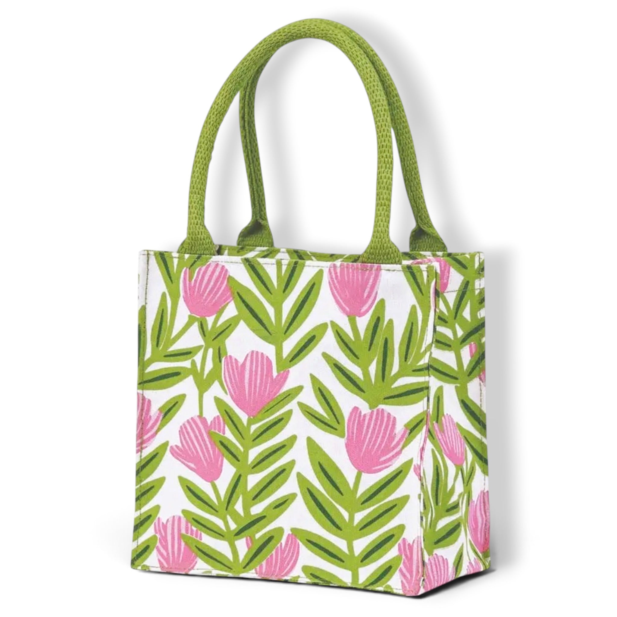 A white canvas tote bag with a green and pink botanical pattern, featuring two green woven handles, shown on a clean white background.