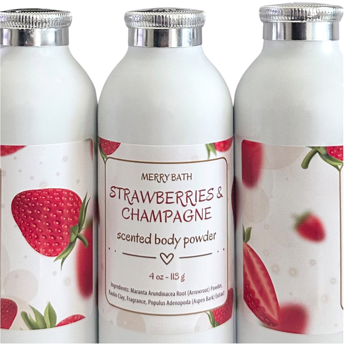 White body powder bottles showing Strawberries & Champagne label and strawberry graphics