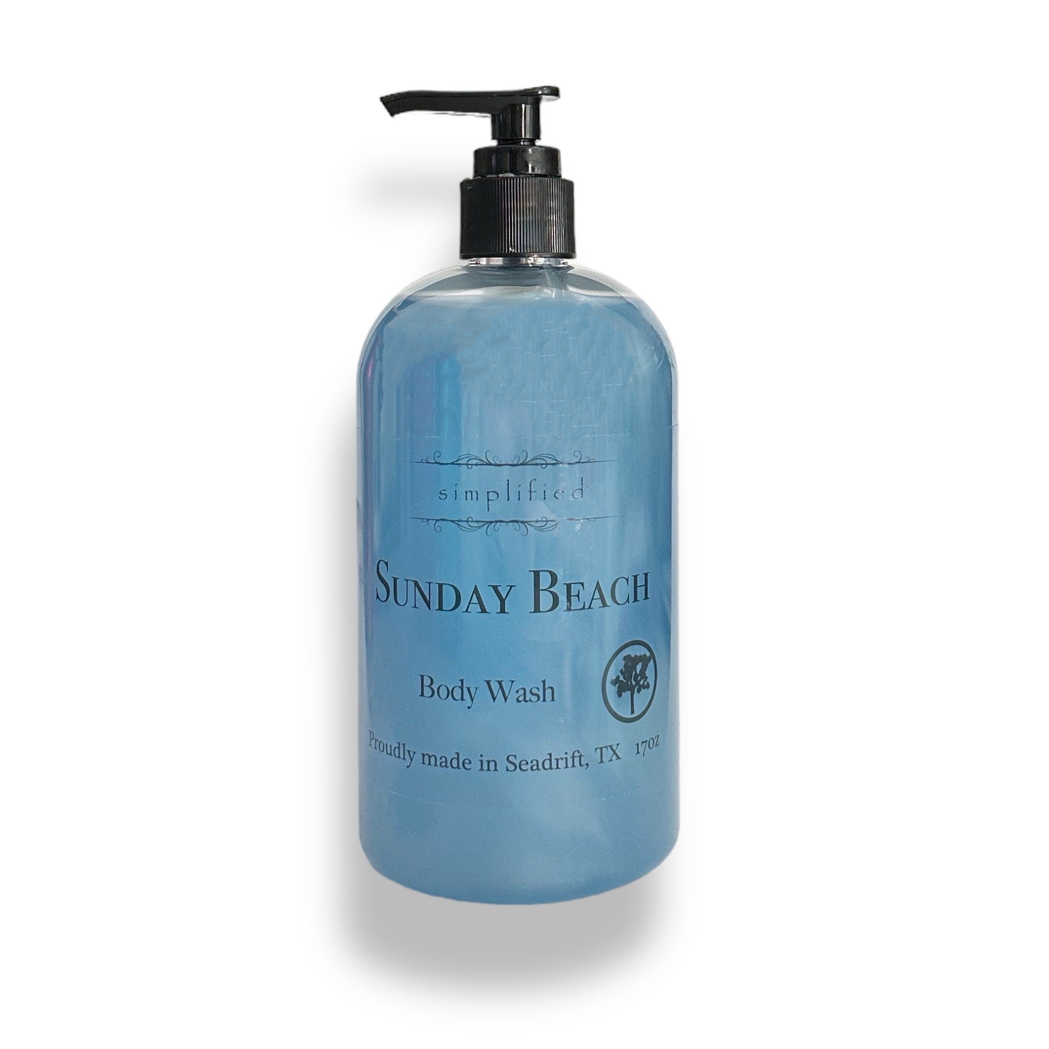 Blue bottle of 'Sunday Beach' body wash with pump on a white background