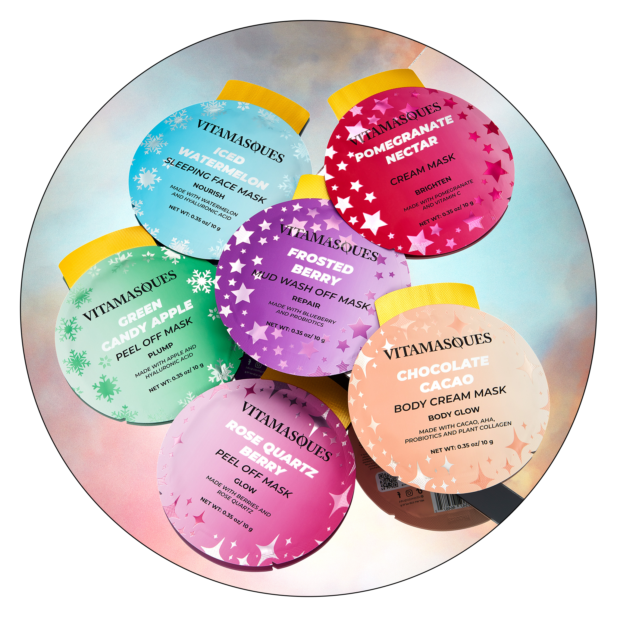 Six round Vitamasqües face and body mask products arranged in a circle on a pastel gradient background. The labels include Sleeping Face Mask, Iceberg Watermelon Sleeping Face Mask, Green Candy Apple Peel Off Mask, Frosted Berry Nude Wax Off Mask, Rose Quartz Peel Off Mask, and Chocolate Cacao Body Cream Mask.