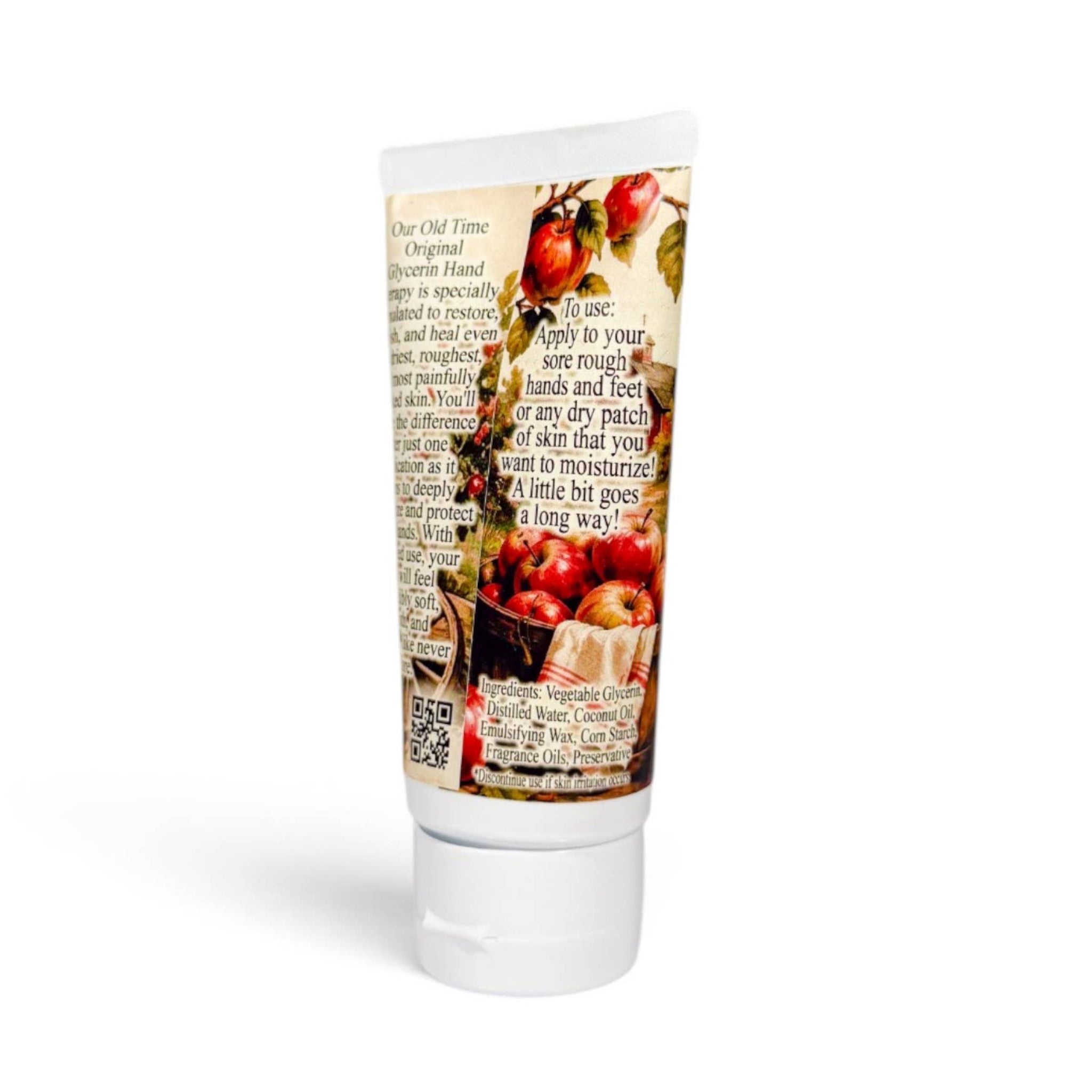 A squeeze tube of hand cream or moisturizer with a vintage-style label featuring red apples, handwritten text, and a white cap, shown on a clean white background.