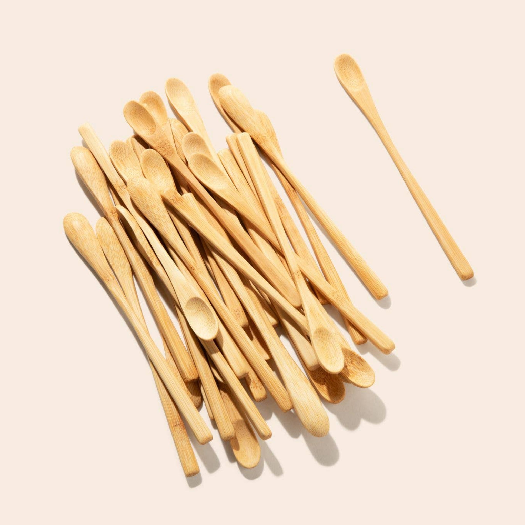 Set of light bamboo mixing spoons with rounded bowls on long handles