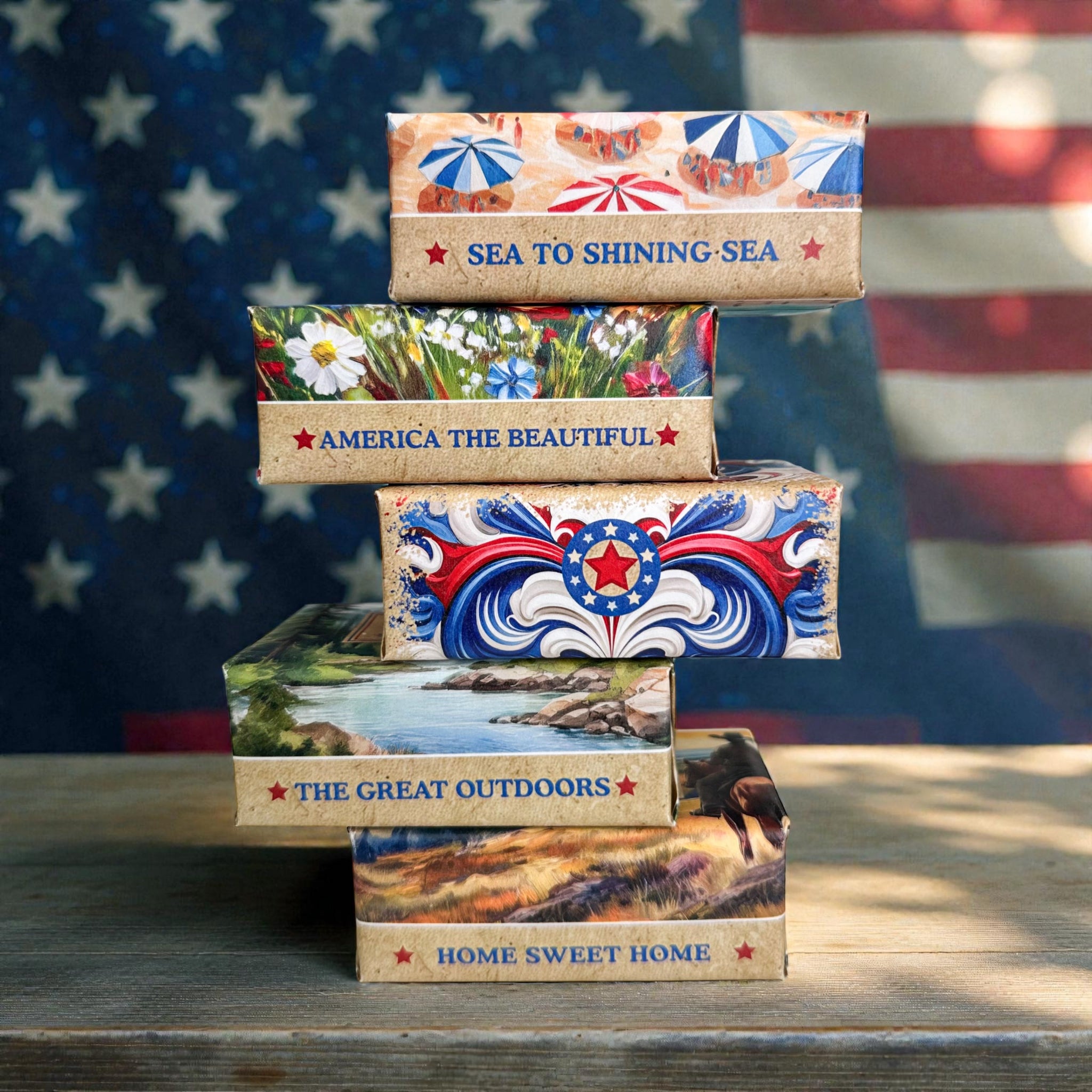 Stack of American-themed shea butter soap bars in illustrated paper boxes