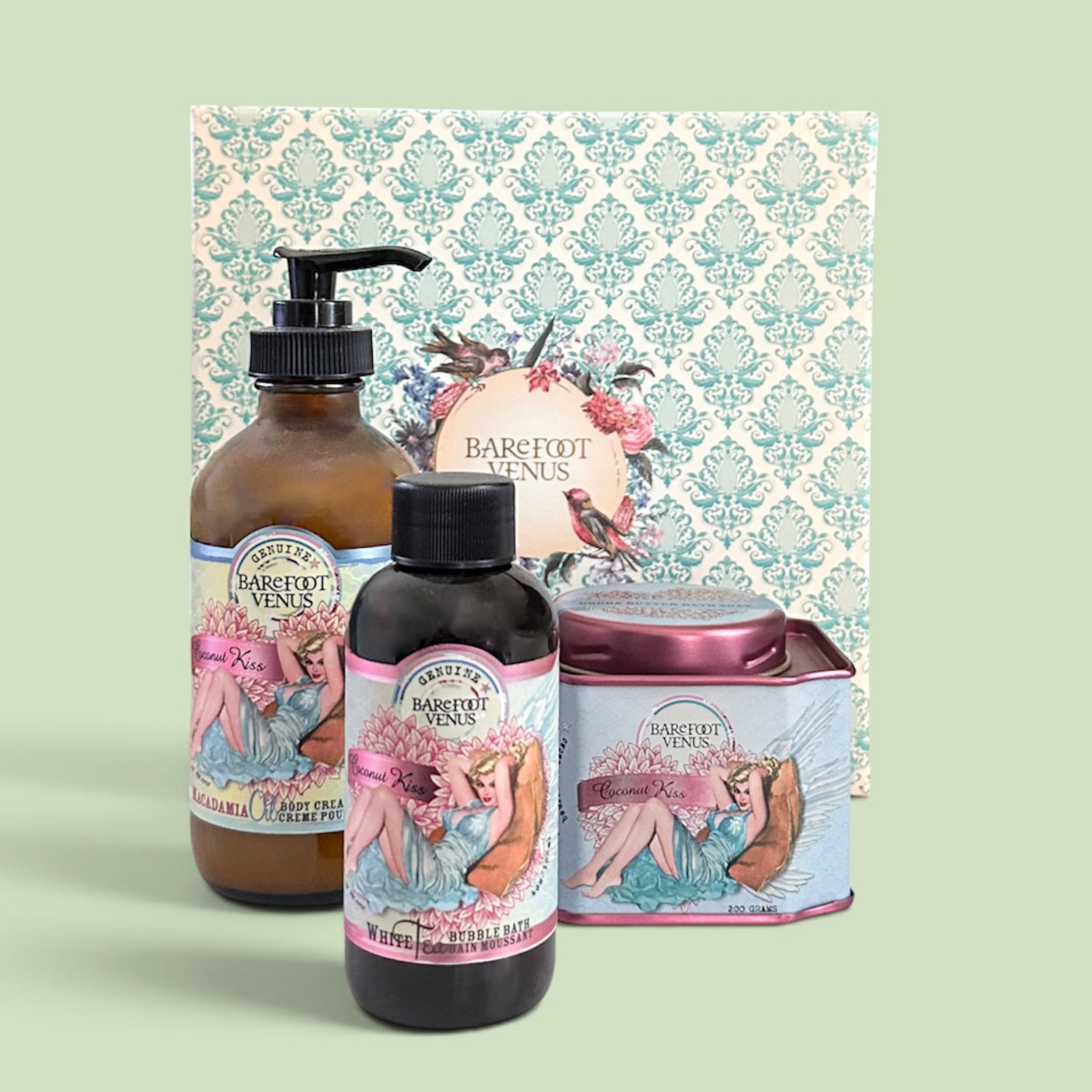 Bath gift set with brown pump bottle, dark bottle, and pink metallic tin