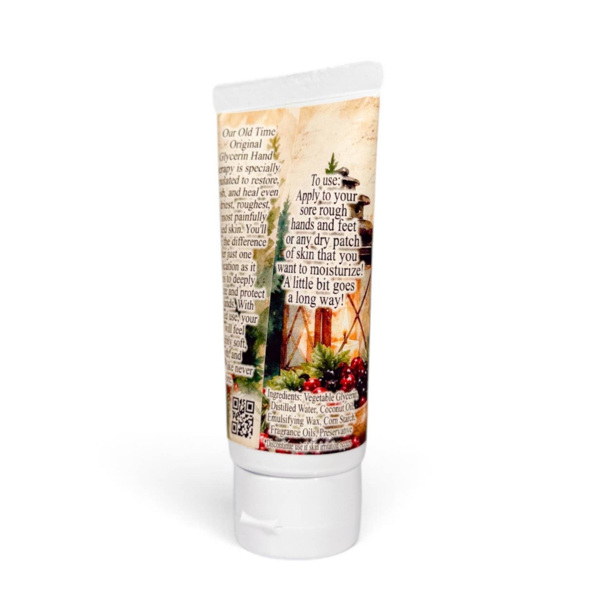 A white squeeze tube of hand cream with a decorative printed label featuring a rustic garden scene and text, shown on a white background with a soft shadow.