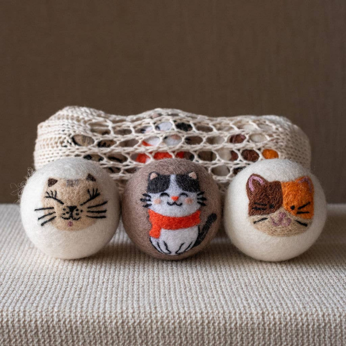 Natural wool dryer balls gift set of 3, three cat-face balls in a mesh pouch