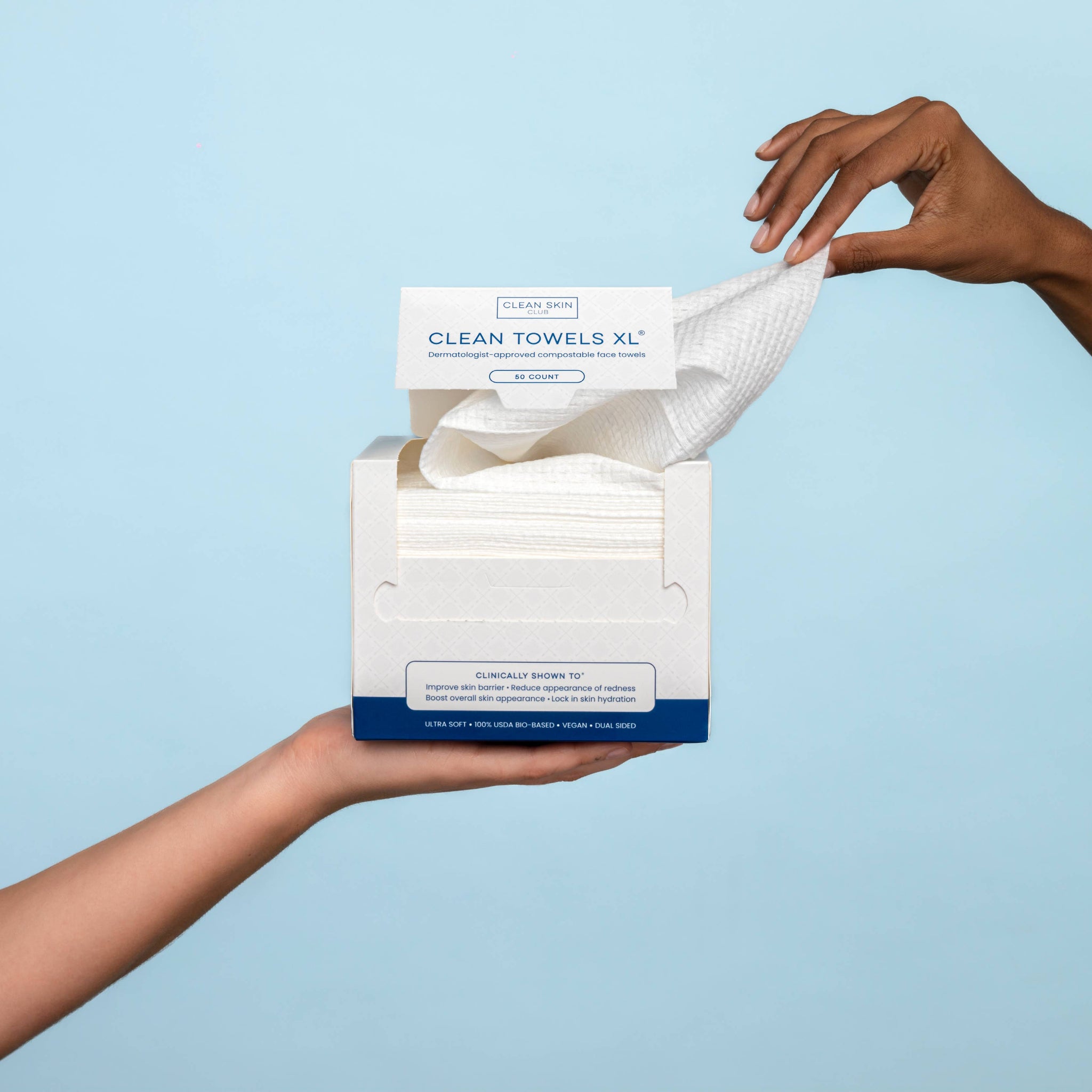 Open box of Clean Towels XL disposable face towels with one towel pulled out.