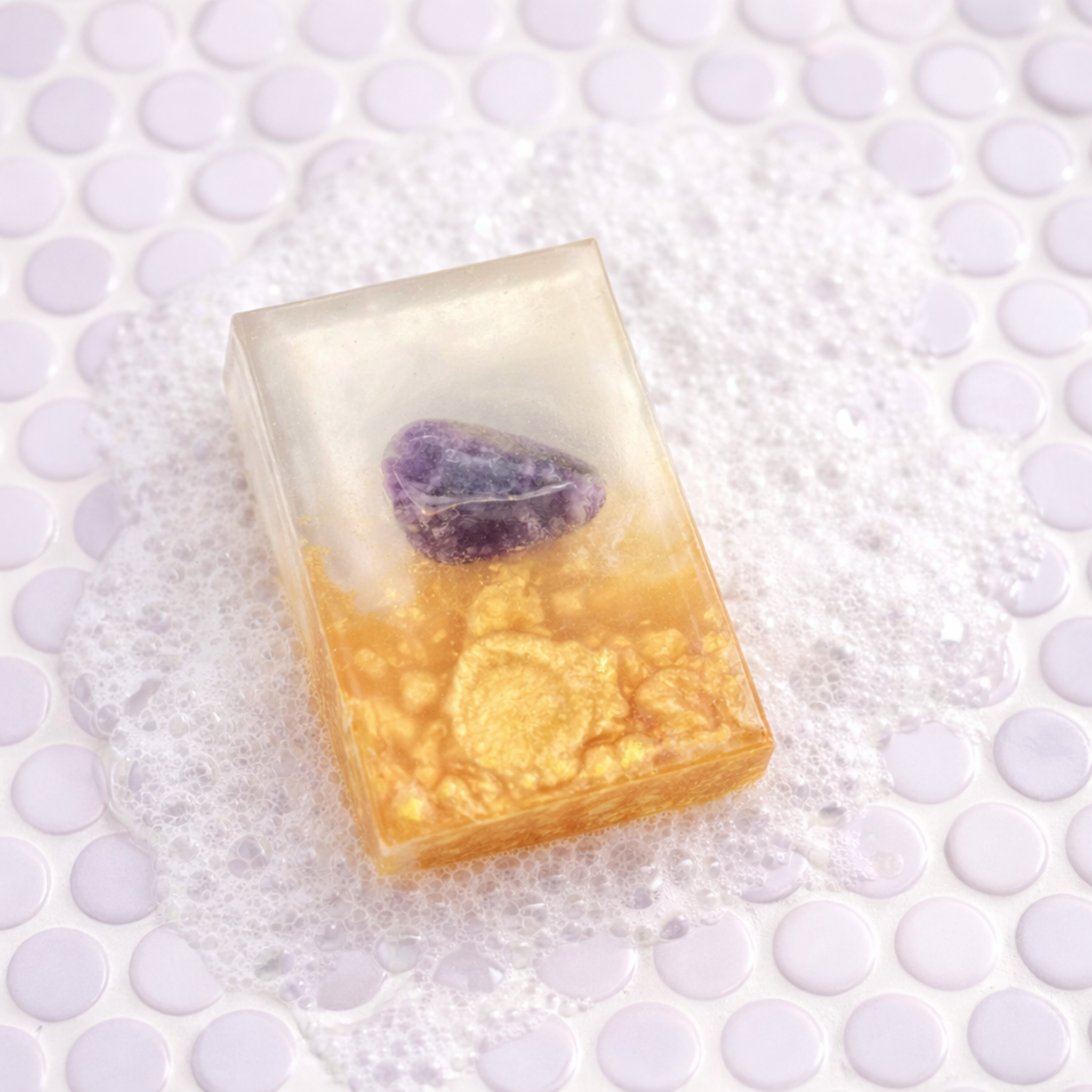 Rectangular soap with embedded stones on a textured white background