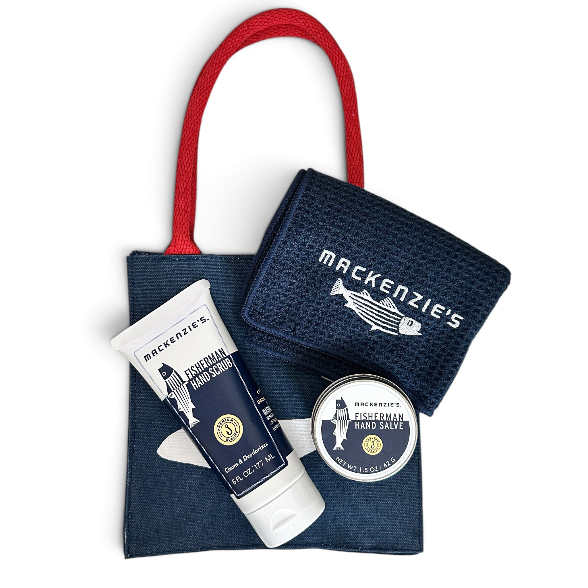 Mackenzie's Fisherman's Hand Sanitizer gift set featuring a navy blue canvas tote bag with a red handle, a navy blue textured hand sanitizer pouch, a tube of personal hand sanitizer, and a round tin of hand sanitizer on a white background.