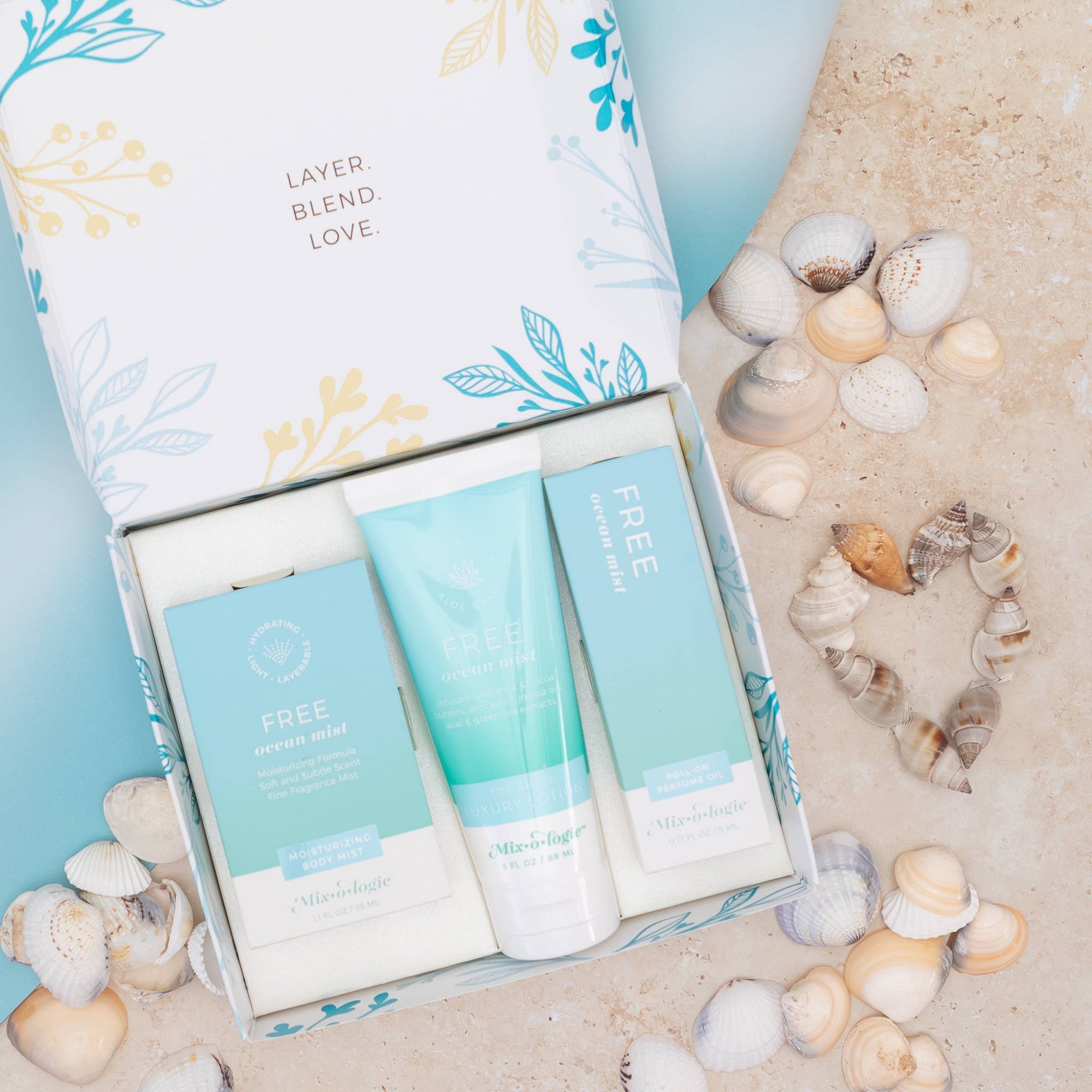 Skincare products in a box with seashells on a sandy background