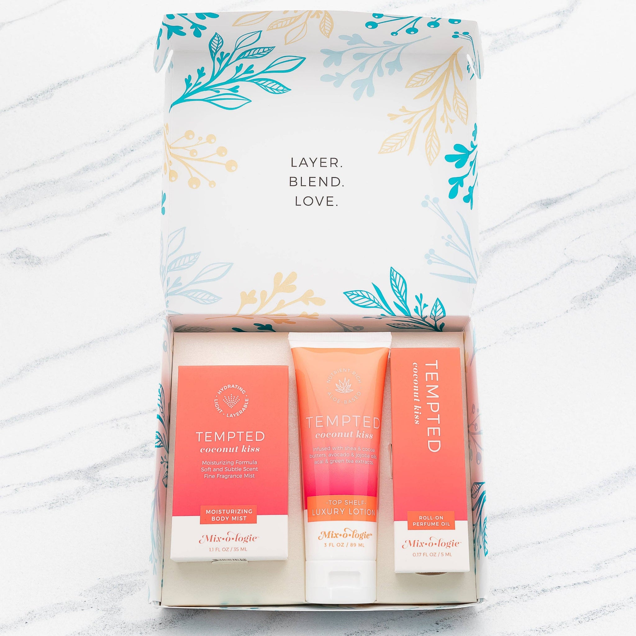 Set of three 'Tempted' products in a decorative box on a white background