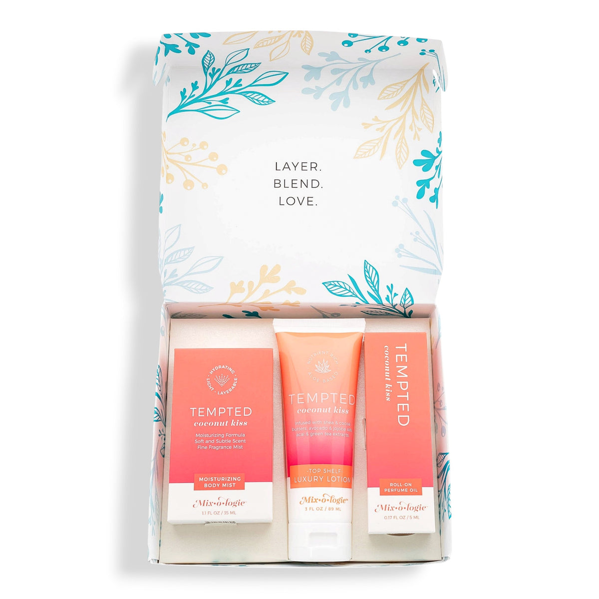 A curated beauty gift set in a white box with a floral patterned lid, containing Tempted moisturizer and hand cream tubes from Missha and a Miraculous hand cream tube from Dr. Lipp.