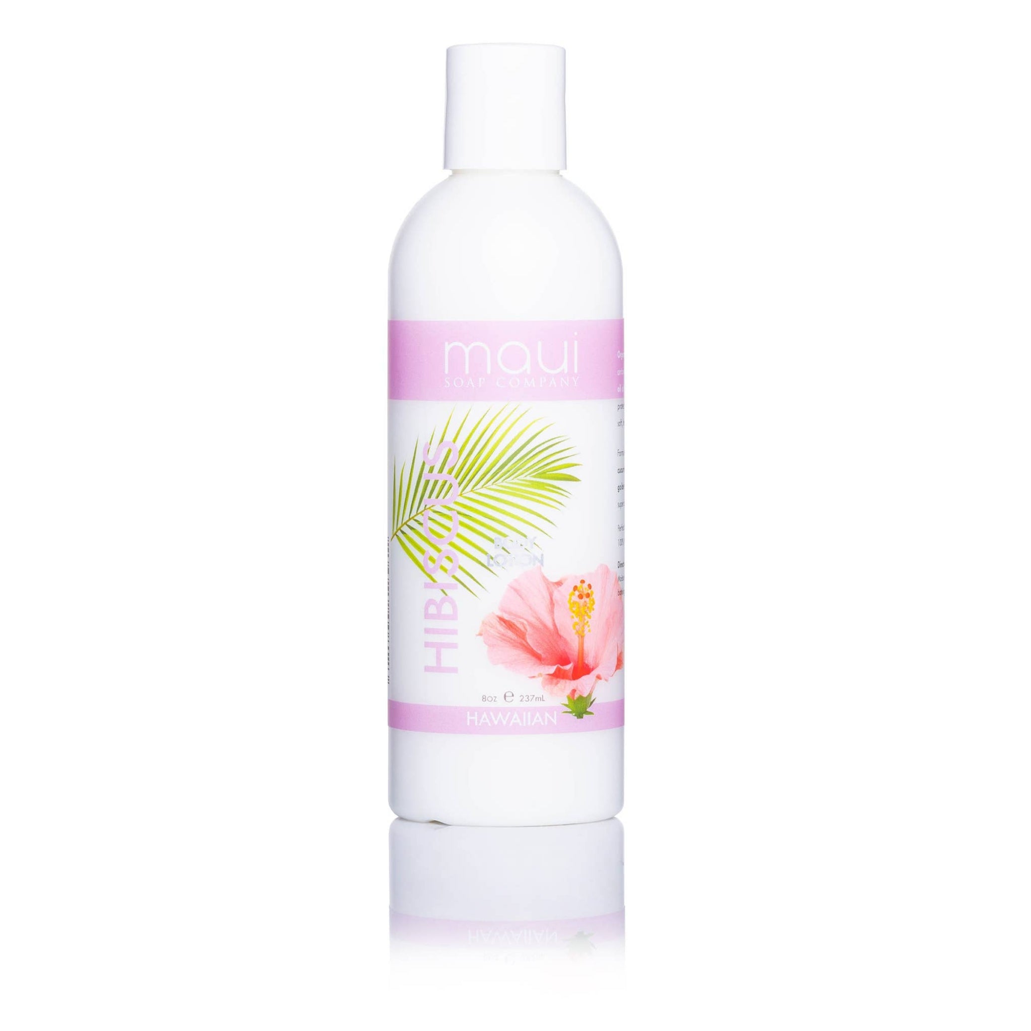 White bottle with a colorful label featuring a palm leaf and flower on a white background
