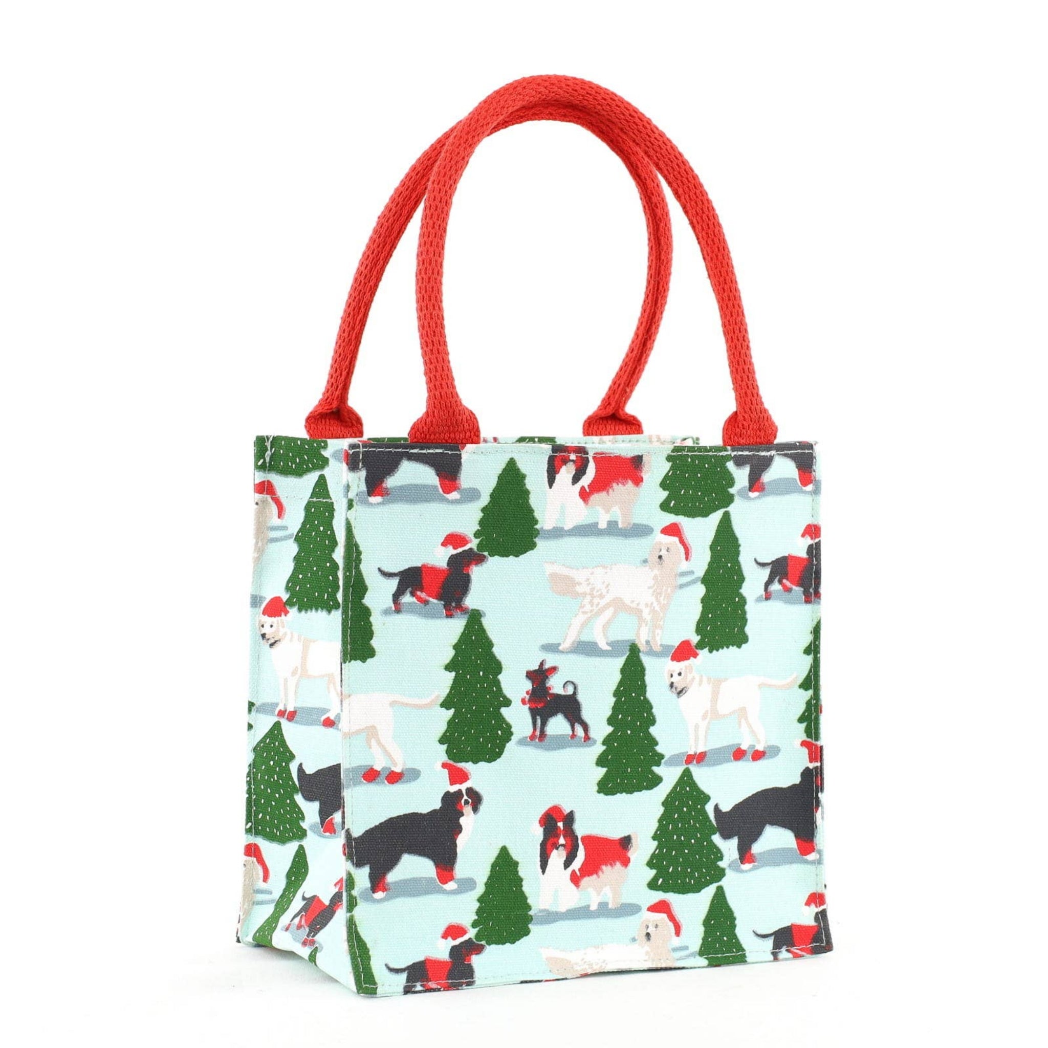 Small bag with Christmas-themed dog pattern and red handles on a white background