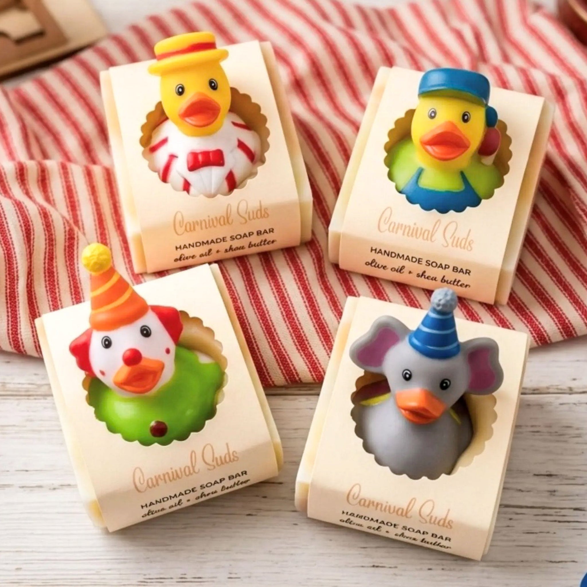 Kids' handmade soap bar set with four circus character faces in colorful toppers