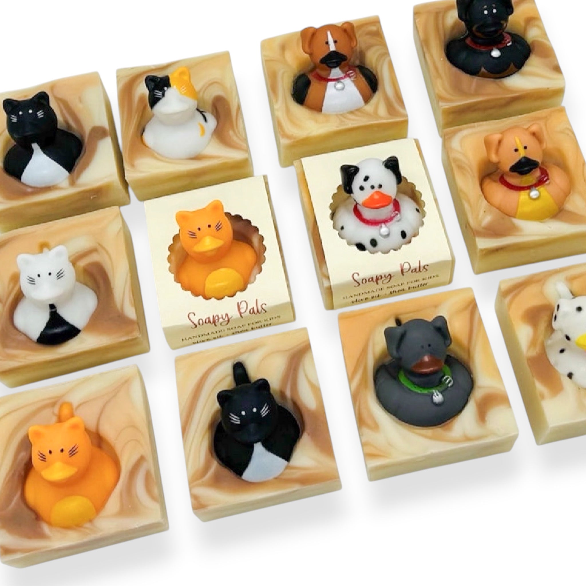 Handmade kids soap bar assortment in individual molded animal shapes on a tray