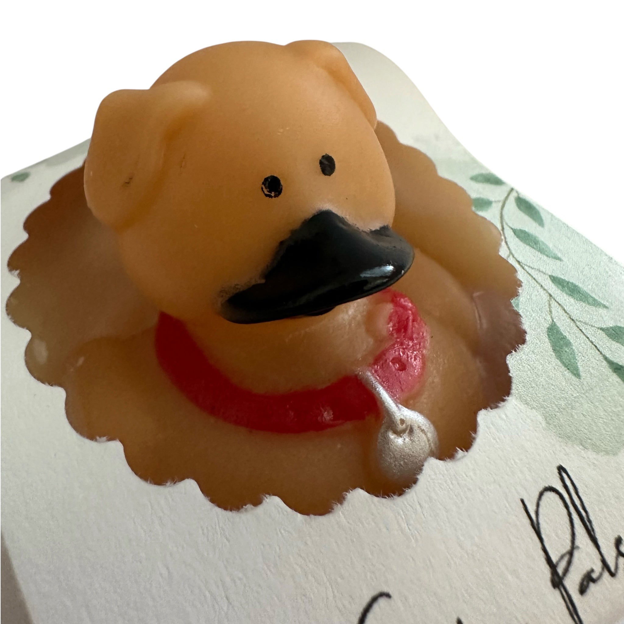 Handmade kids soap bar shaped like a brown dog with red collar