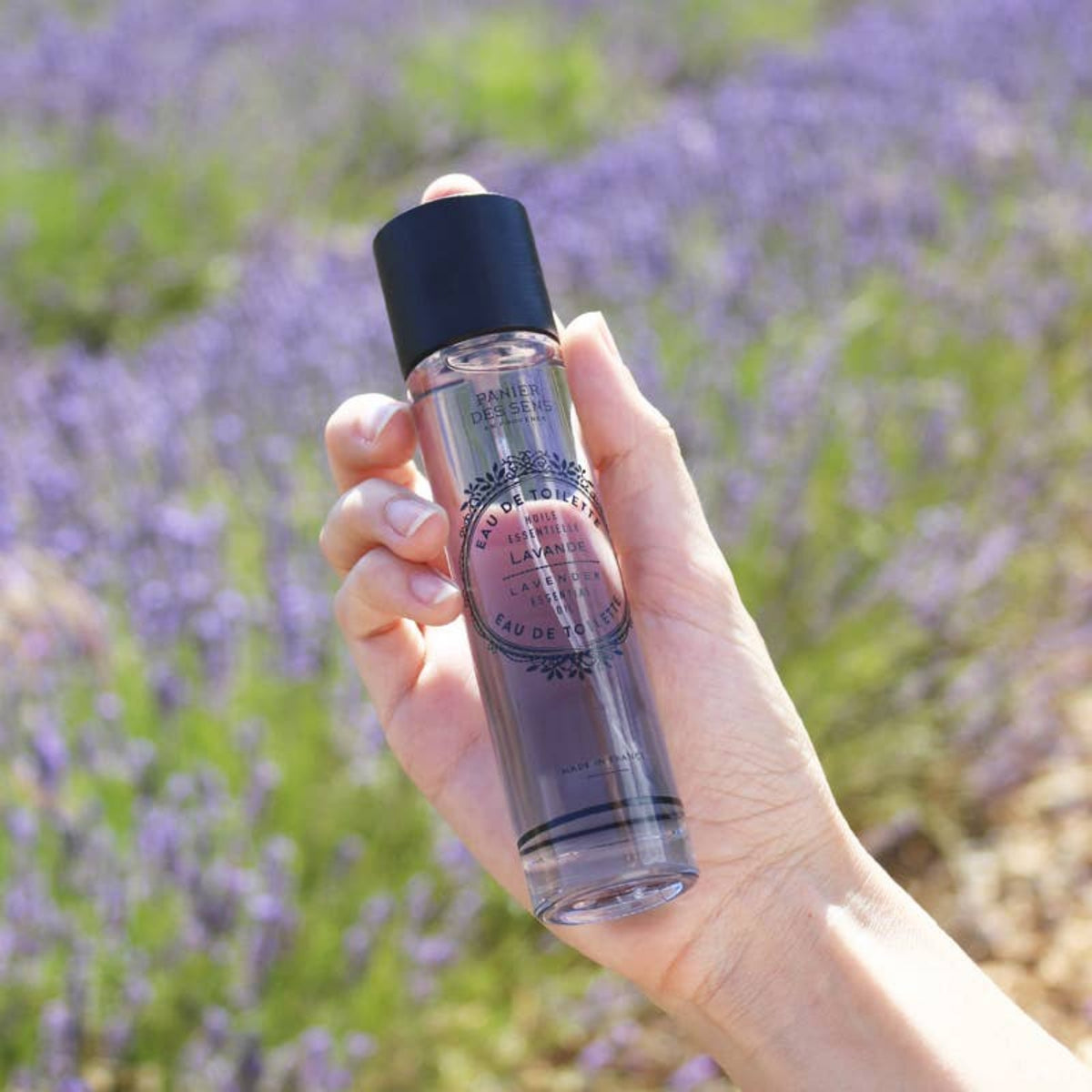 Lavender eau de toilette spray bottle in hand, Panier des Sens 1.7 fl oz