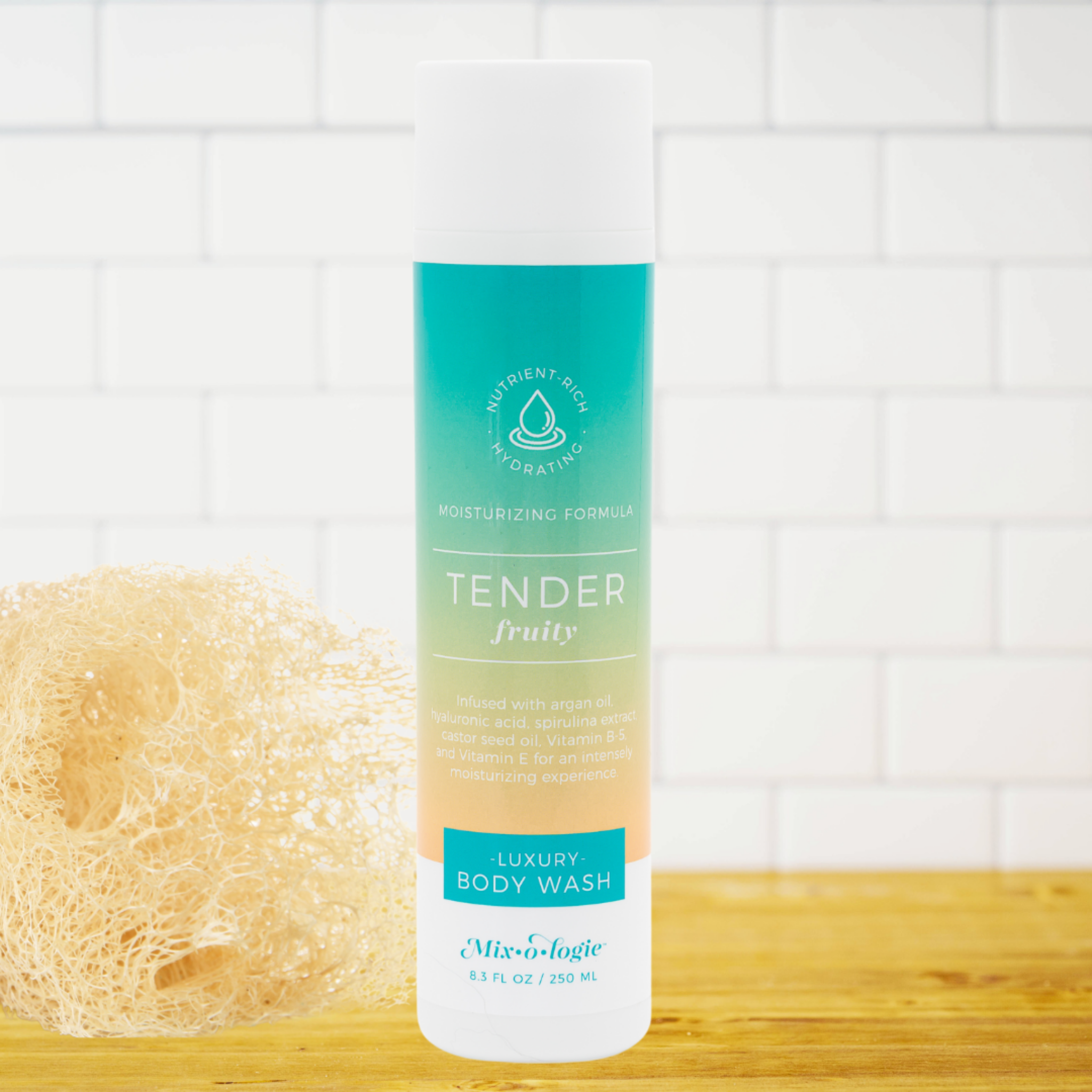 Tender body wash bottle with a sponge on a wooden surface and tiled wall background