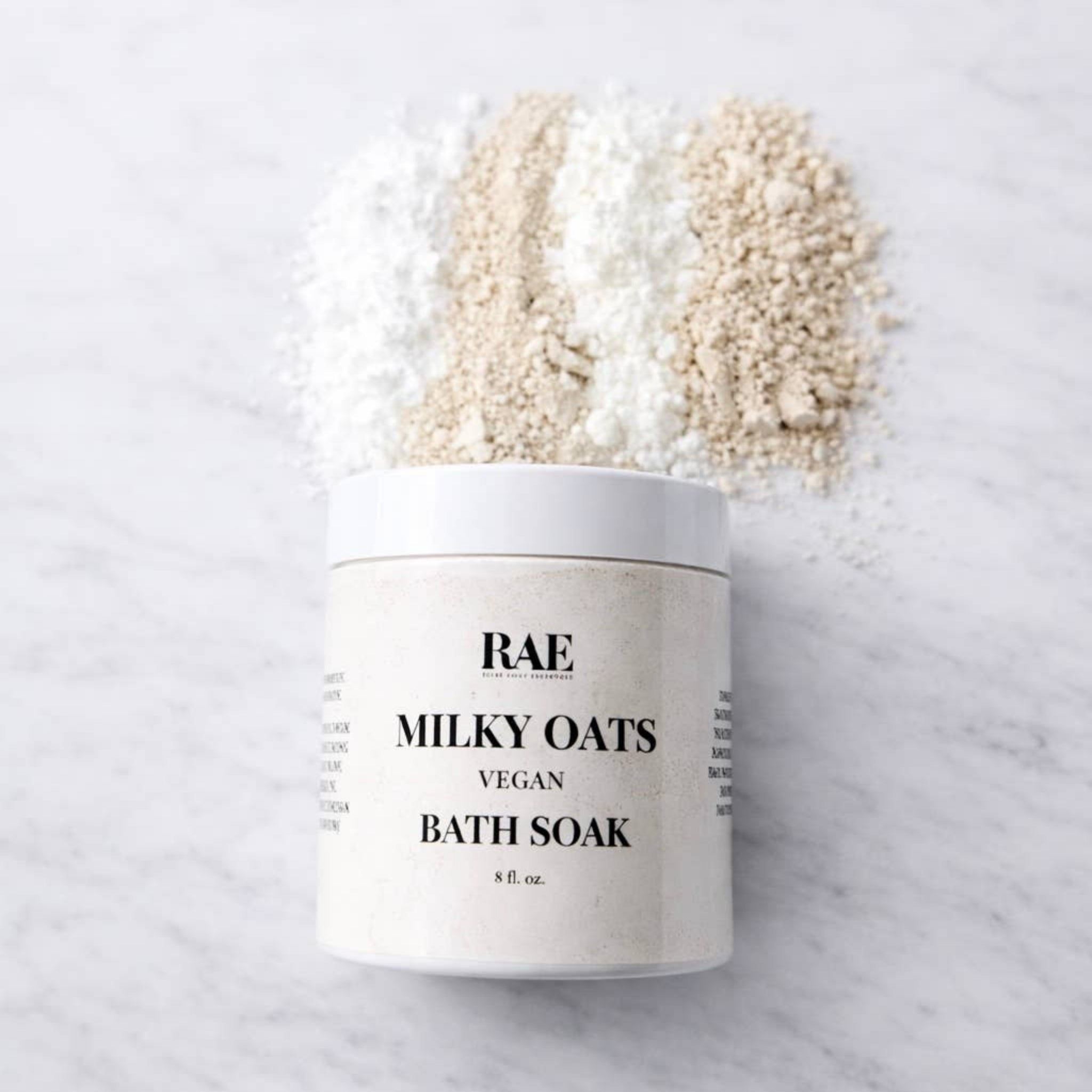 RAE milky oats vegan bath soak jar filled with creamy oats.