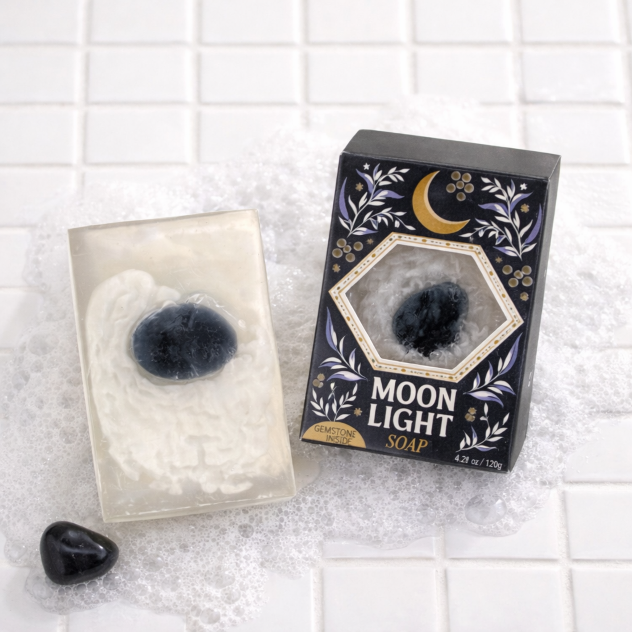 Moonlight soap with packaging on a tiled surface