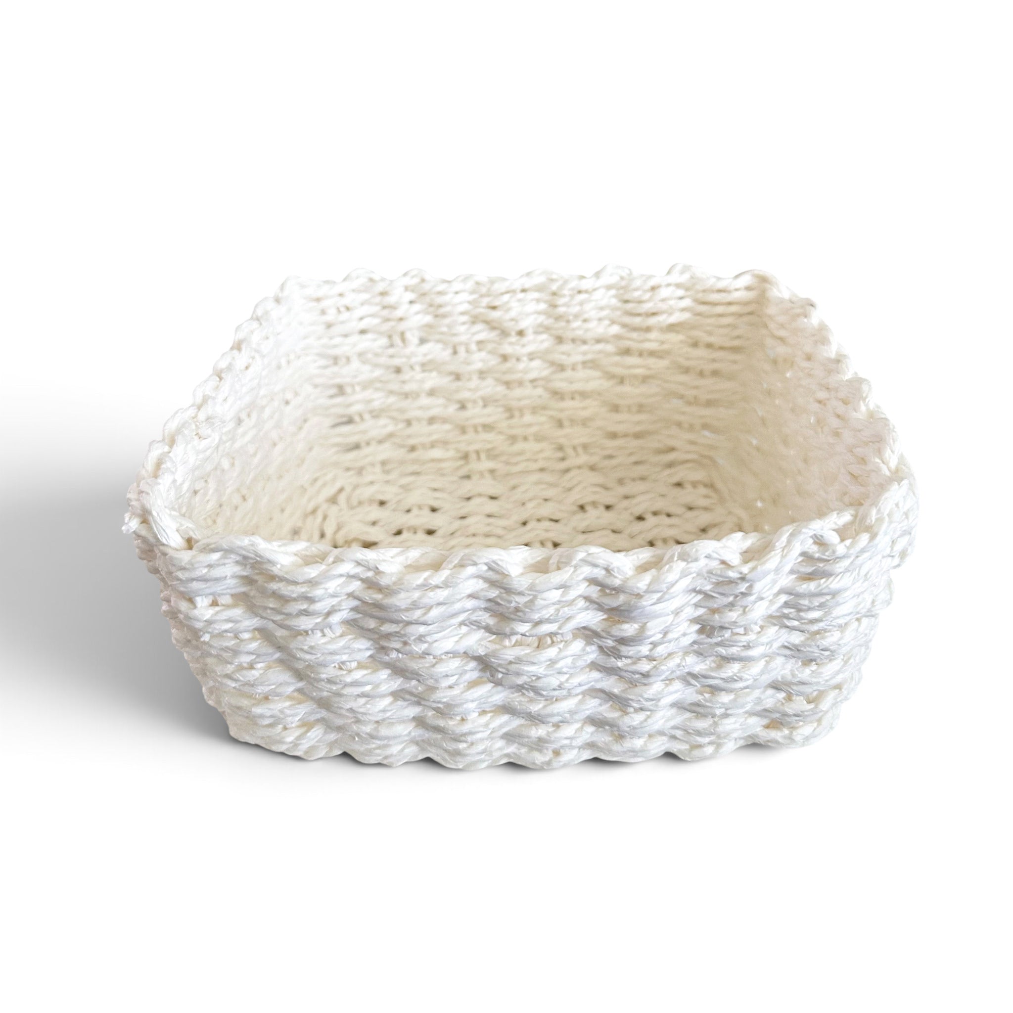A square woven basket made from white rope or cord, shown on a clean white background.
