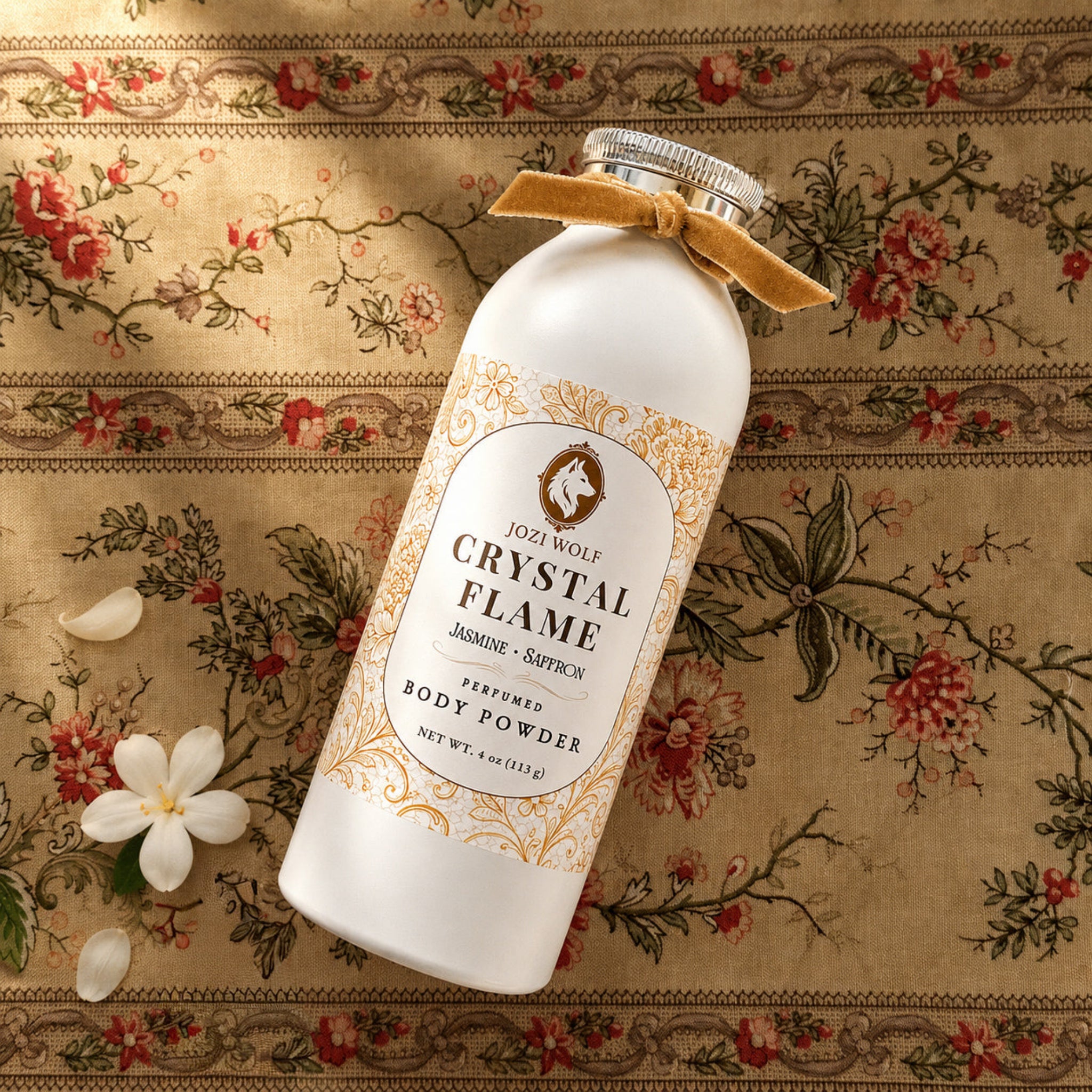 Perfumed body powder bottle with tan bow, white bottle and gold ornamental label