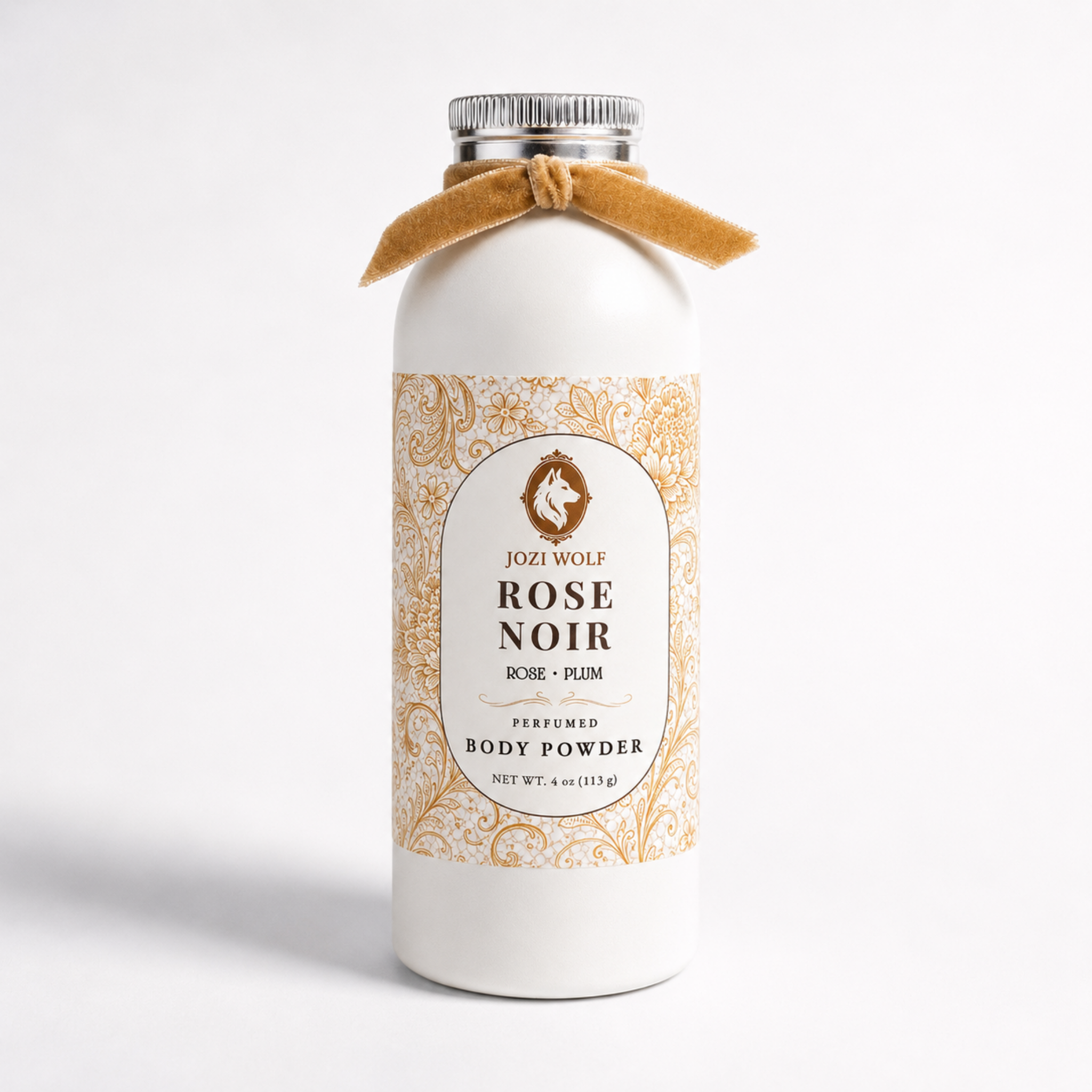 Perfumed body powder bottle with gold ornament label and tan tied bow.
