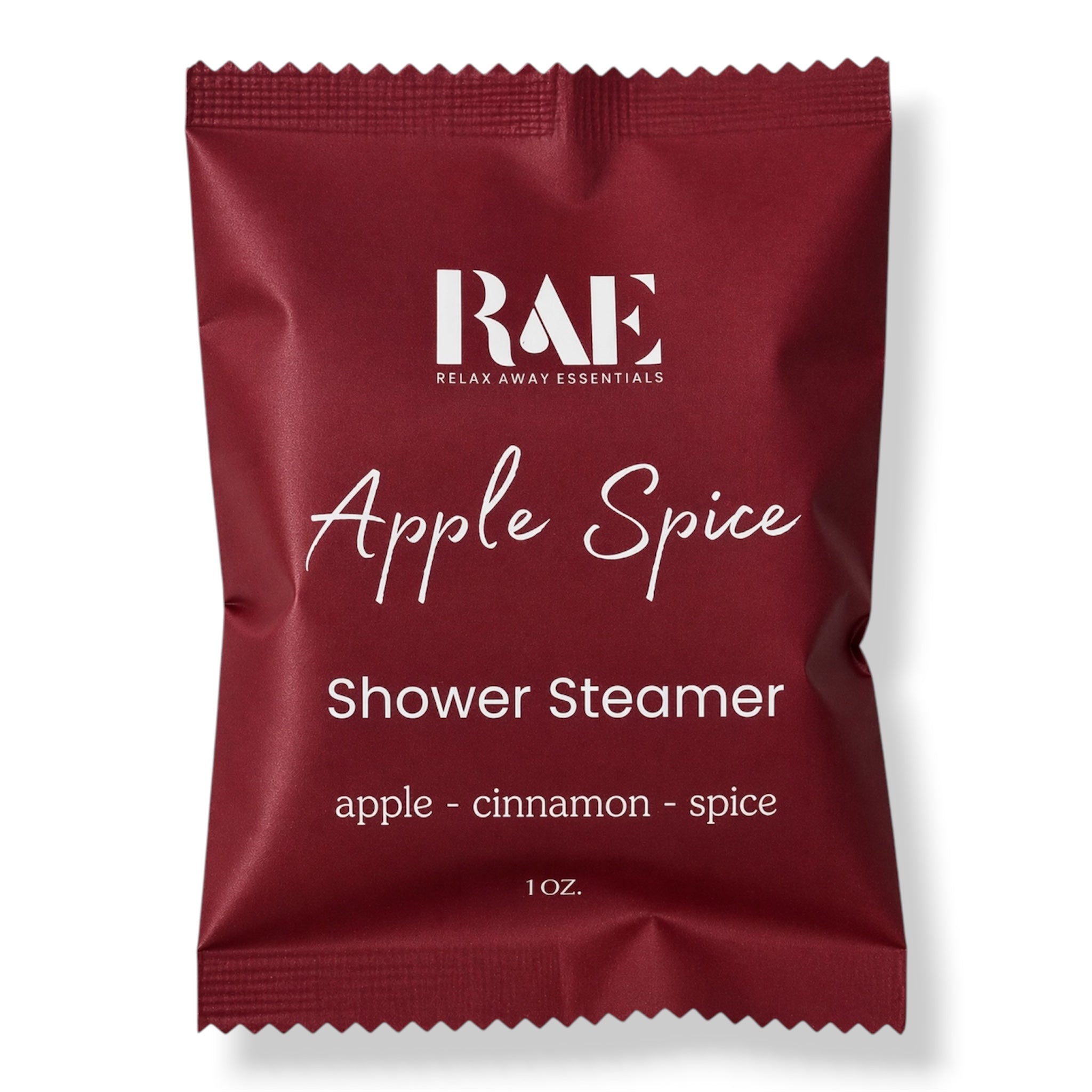 A single RAE Relax Away Essentials Shower Steamer packet in the Apple Spice scent, shown on a clean white background. The packet is deep red with white text detailing the scent notes of apple, cinnamon, and spice.