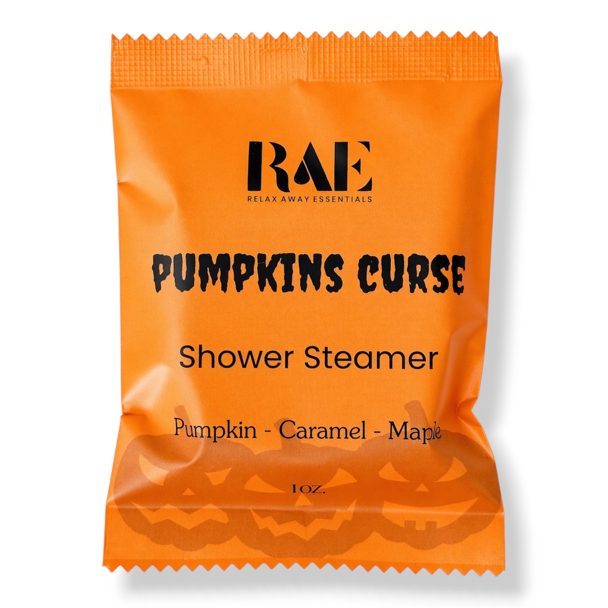 An orange packet of RAE 'Pumpkins Curse' Shower Steamer on a white background. The packaging features black text and a pumpkin graphic at the bottom.
