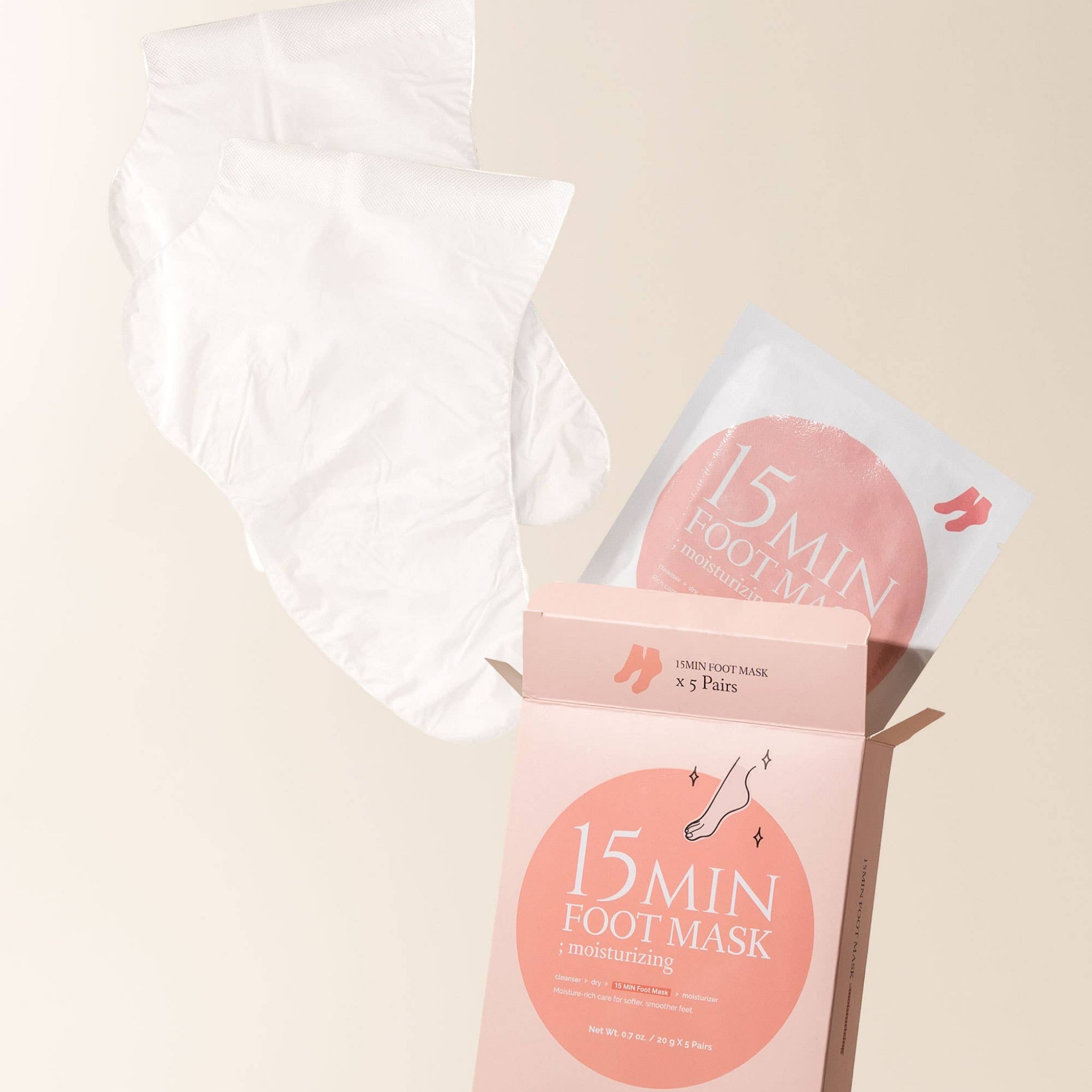 15-minute foot mask packaging with a single mask on a beige background