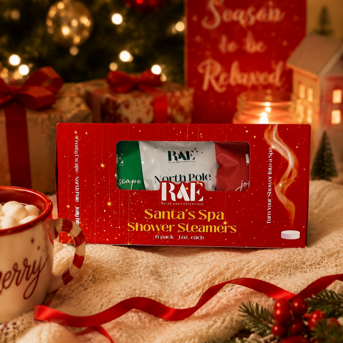 RAE Santa's Spa Shower Steamers packaging with Christmas decorations in the background