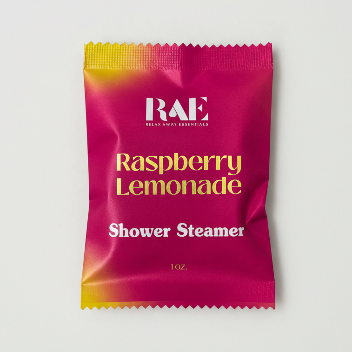 Pink shower steamer packet with yellow text on a white background