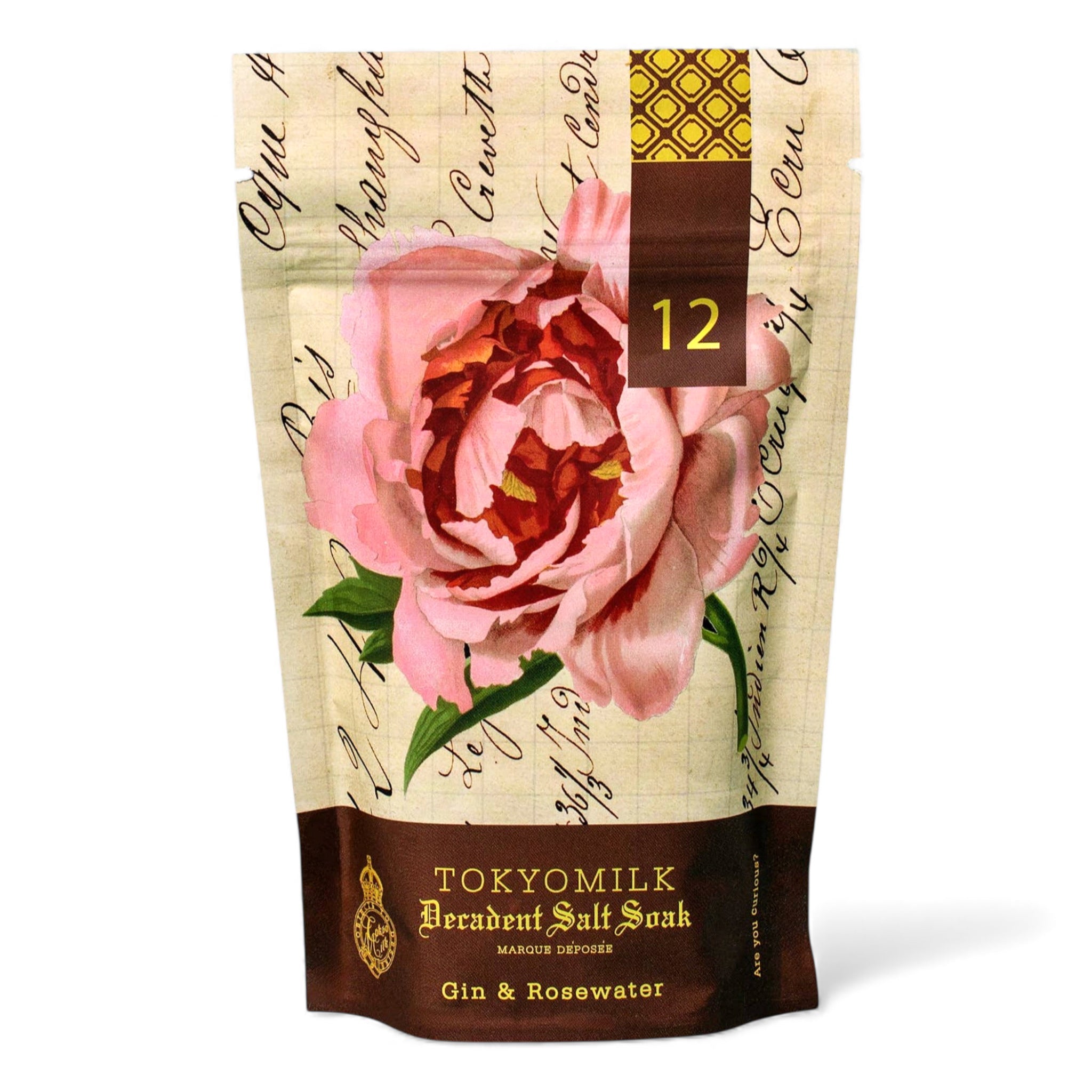 TOKYOMILK decadent salt soak packaging with a pink rose design on a beige background