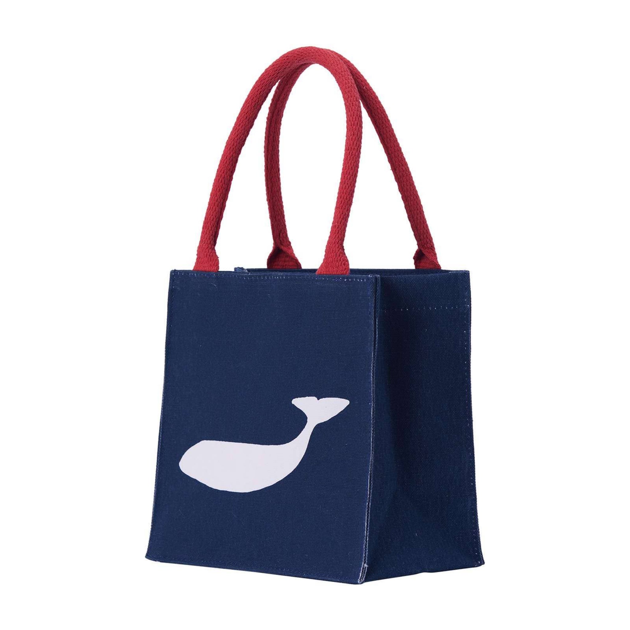 Navy tote bag with red handles and a white whale design on a white background